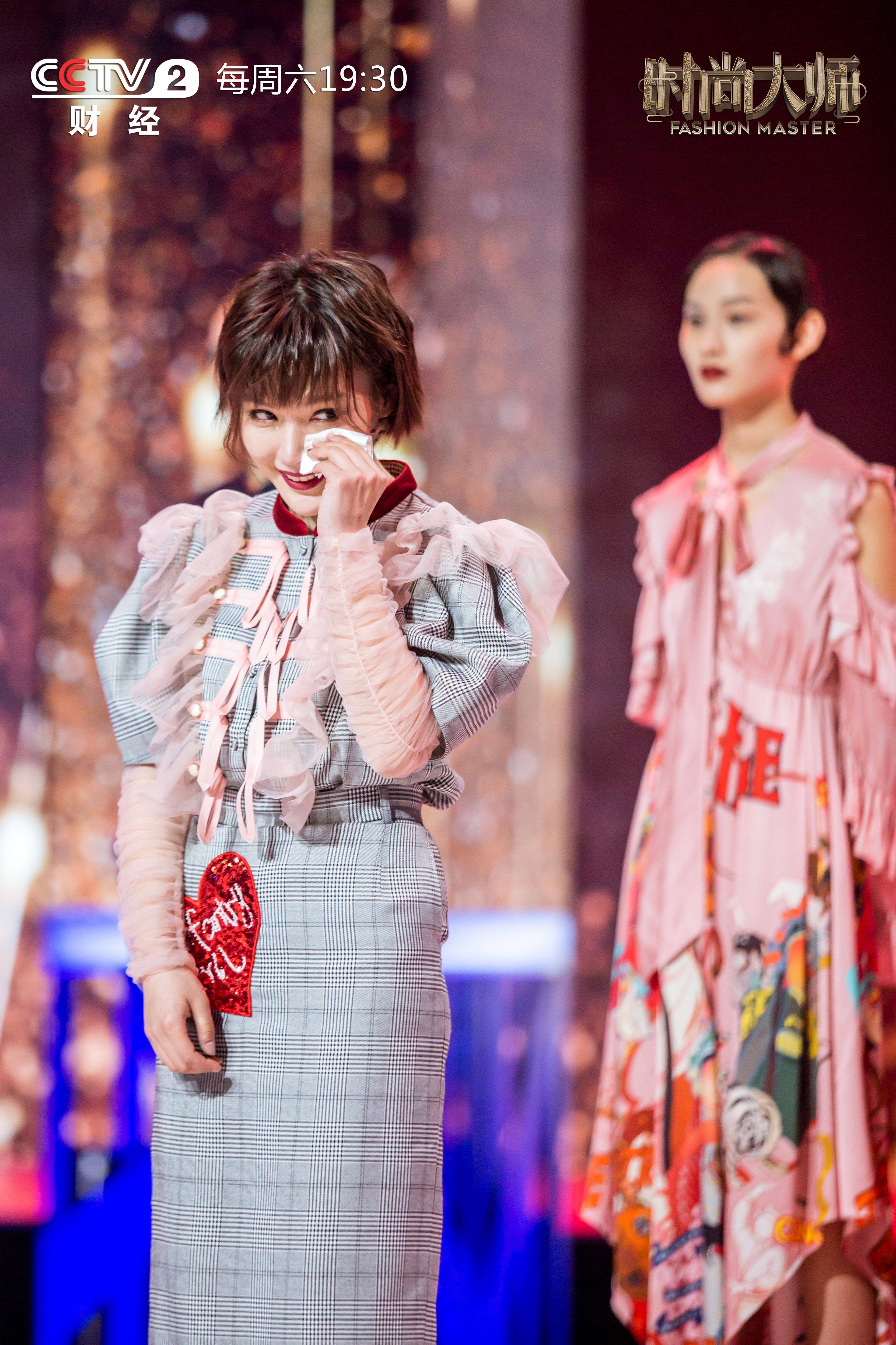 Fashion Master contestant Kate Han Wen wipes away a tear during an episode of the CCTV reality show.