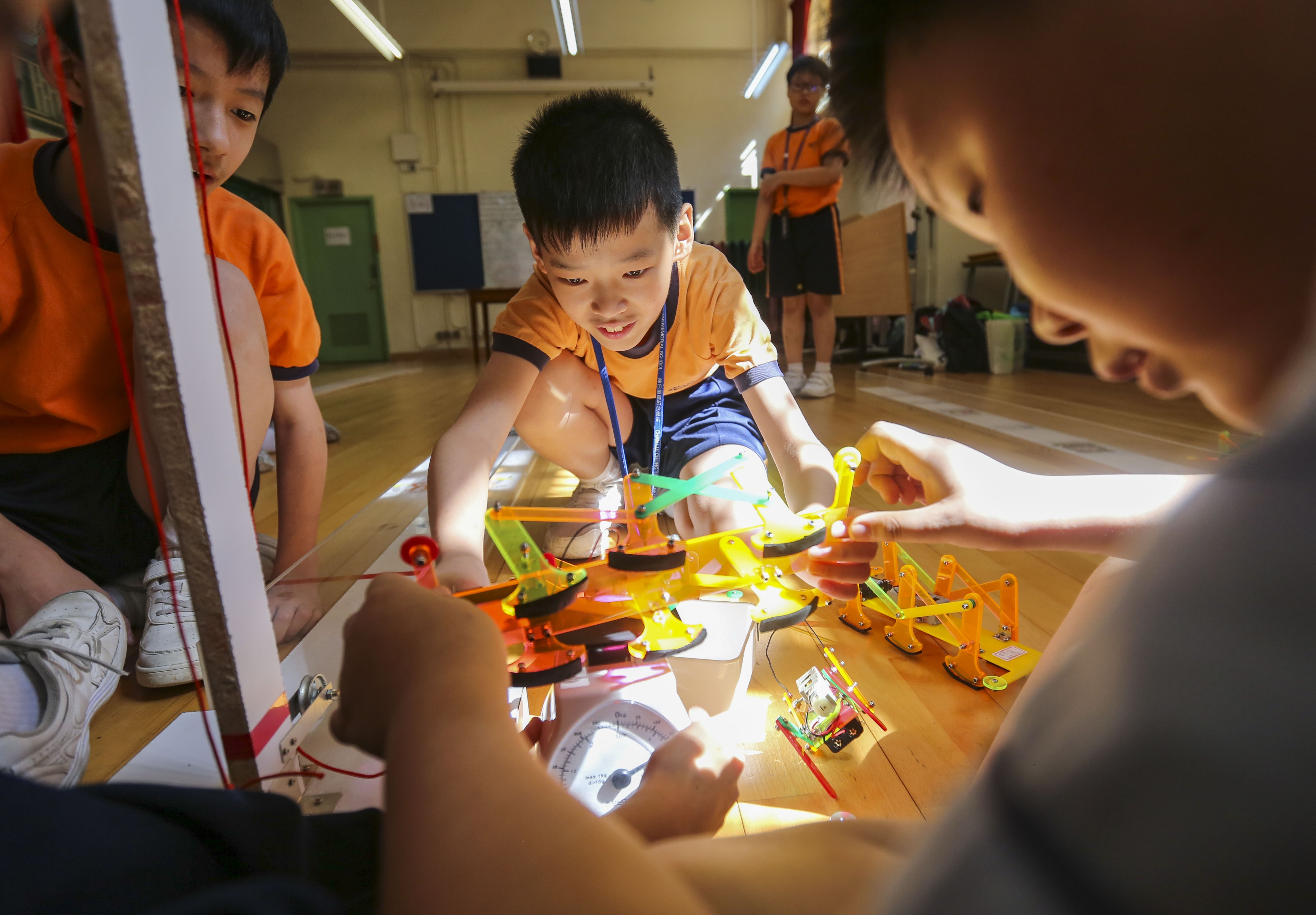 Children line up their robots for a race at the Chan Lui Chung Tak Memorial School in Yau Tong, May 25. Hong Kong is often called upon to speed up the adoption of technology and to prepare children for the digital revolution, or the “fourth industrial revolution”, a future dominated by automation. Photo: Xiaomei Chen