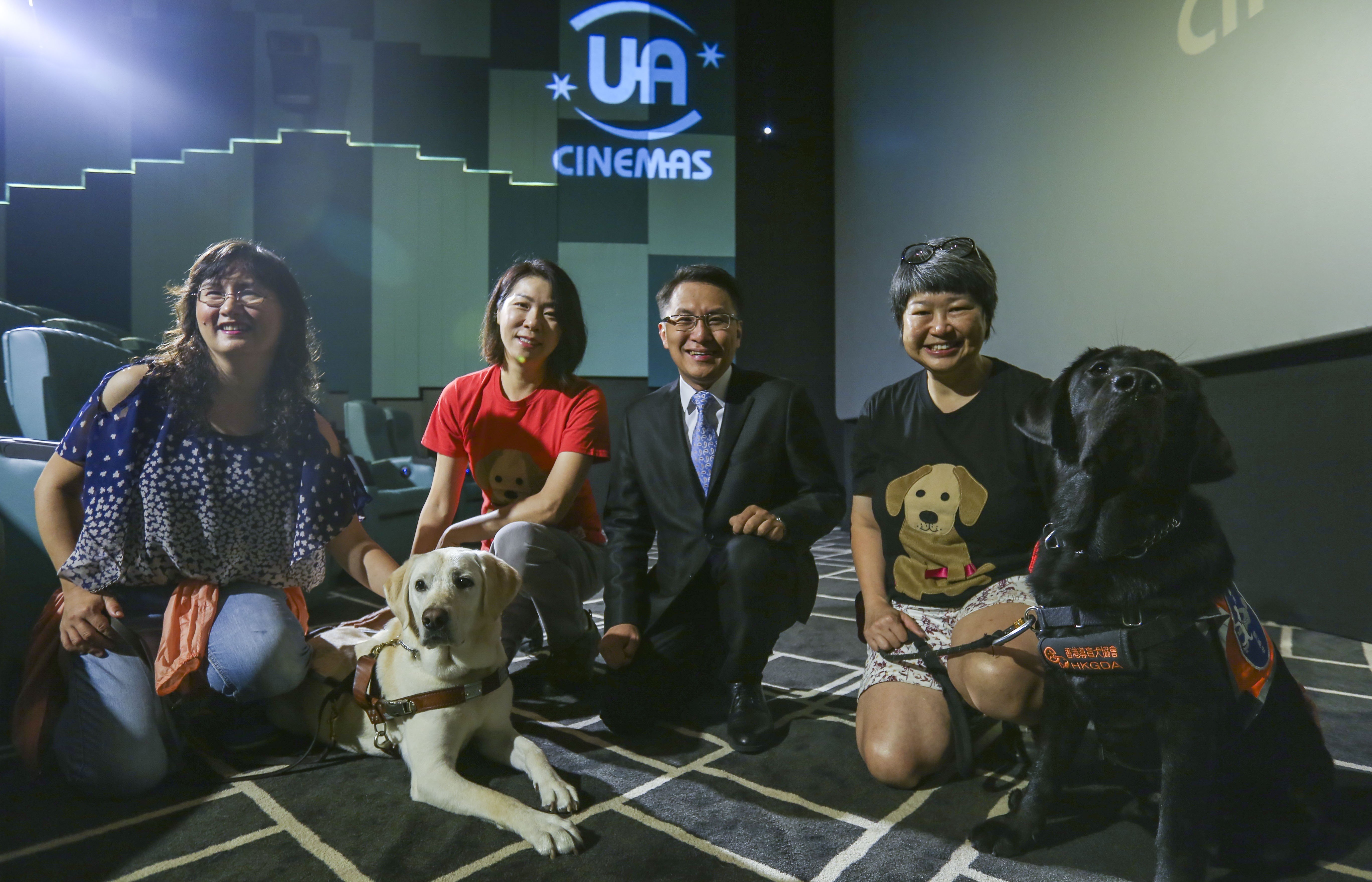 Jean Lin (left) with Bella, Fianna Chi, chairwoman of the Service and Support Committee of the Hong Kong Guide Dogs Association, Ivan Wong, UA Cinemas managing director, and Cynthia Chong Chung-chau, with Oscar at Maritime Square in Tsing Yi. Photo: Xiaomei Chen