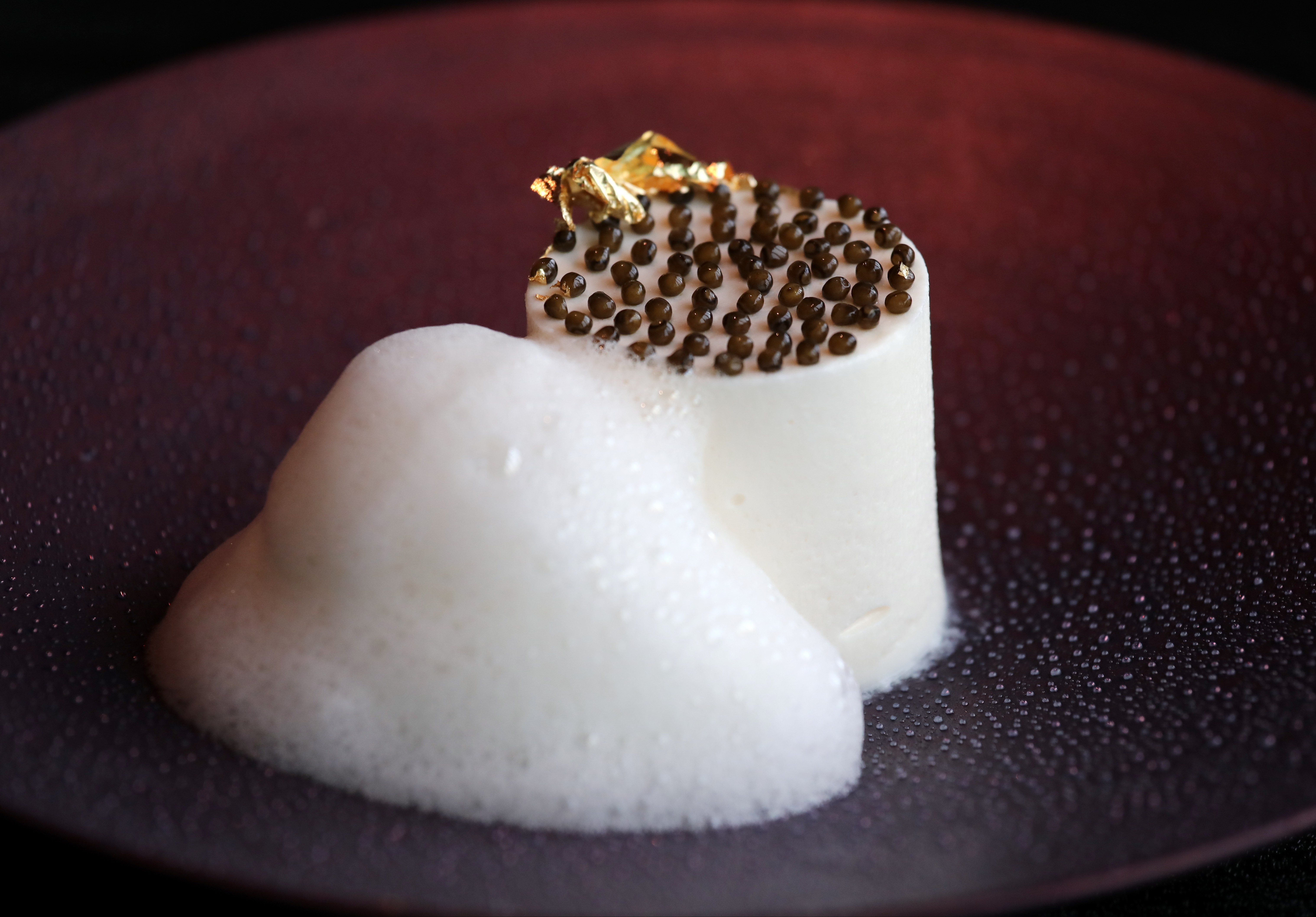 Cauliflower dessert with egg yolk, caviar, white chocolate, and lime foam, available at Écriture. Photo: Jonathan Wong