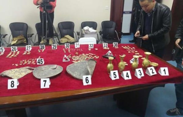 Some of the rare artefacts recovered by police, which were stolen during the raid on the tomb. Photo: CNA