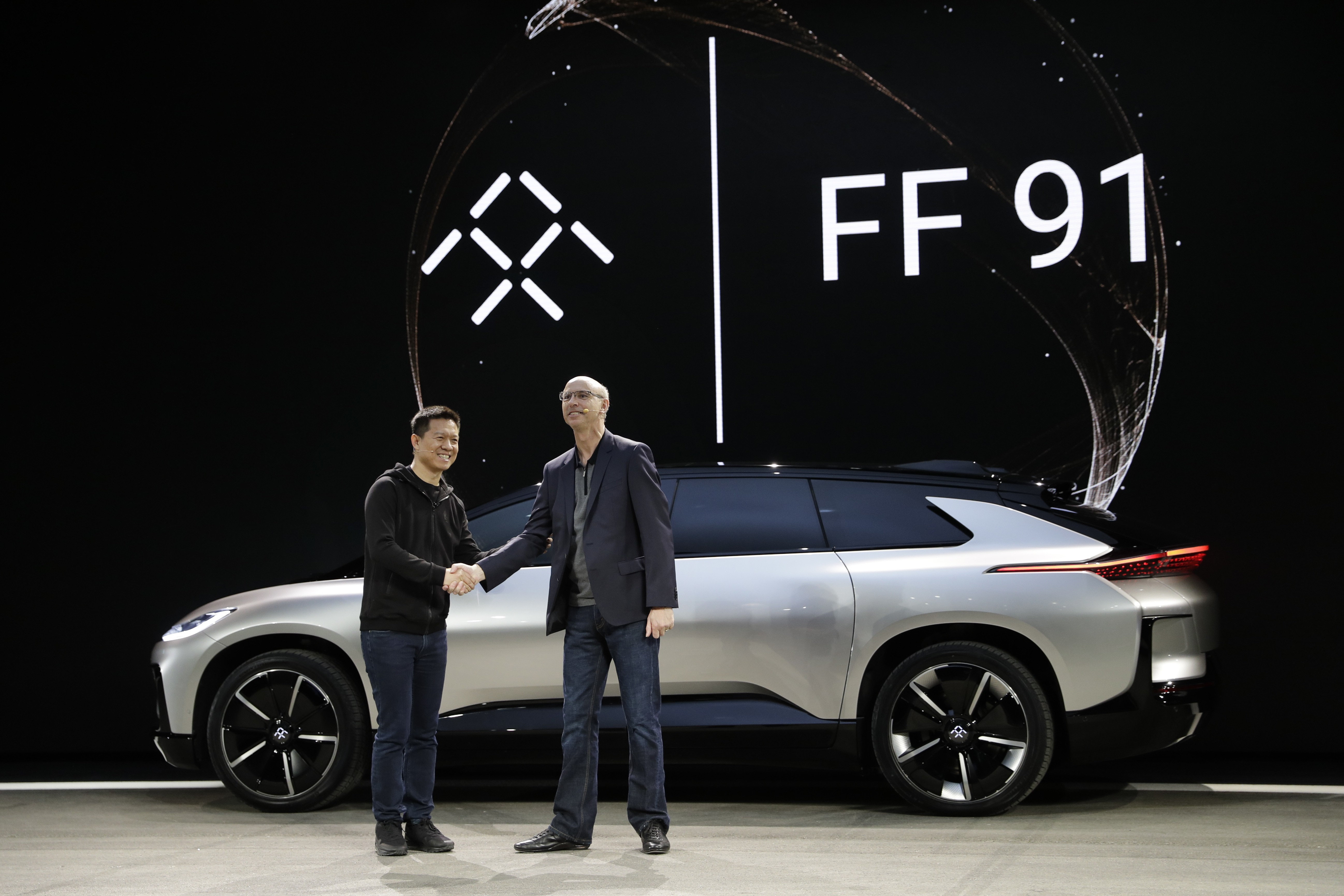 LeEco CEO Jia Yueting (left) and Nick Sampson, Faraday Future’s senior vice-president of product research and development, unveil the FF91 electric car at CES International on January 3, 2017, in Las Vegas. Photo: AP Photo