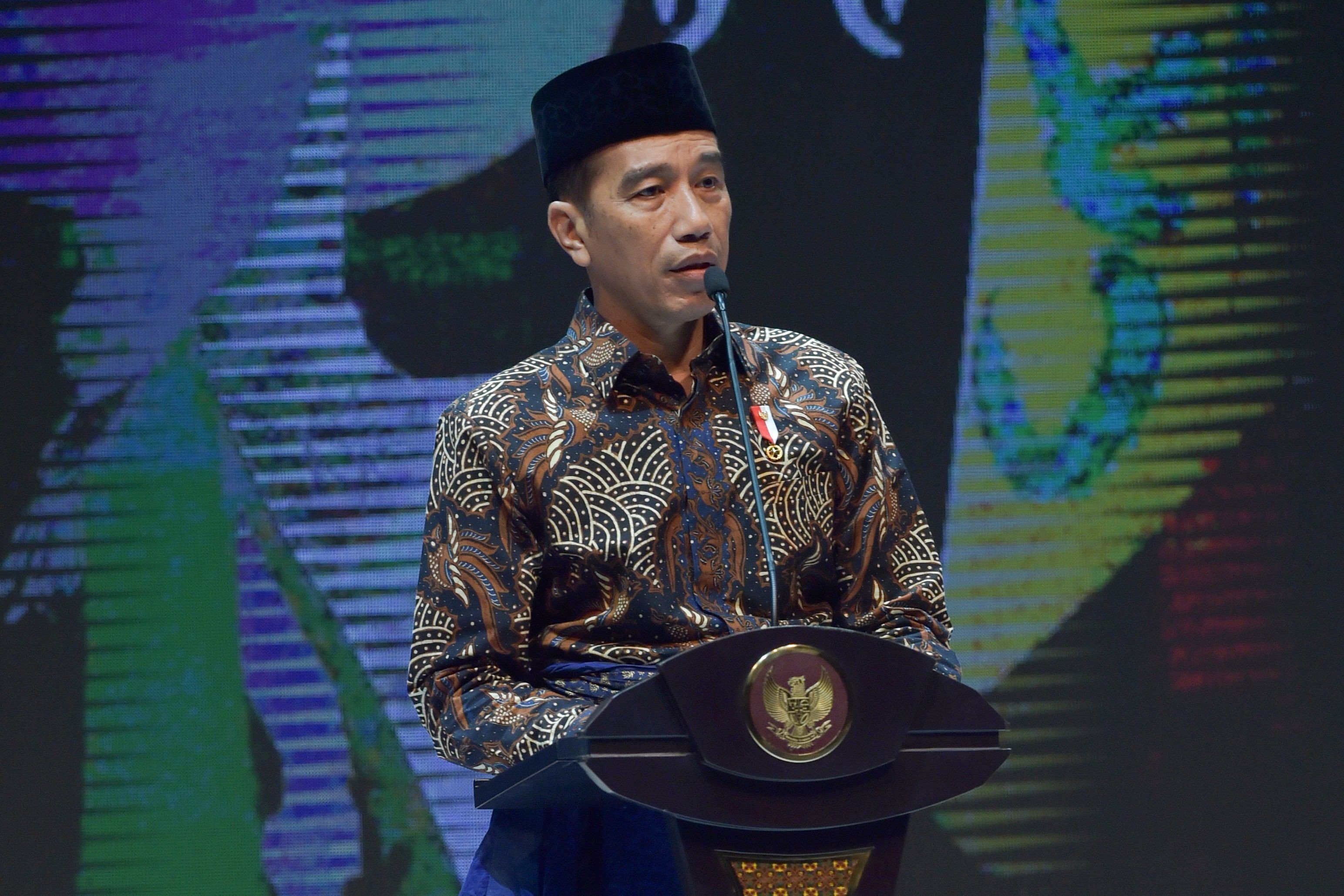 Indonesian President Joko Widodo delivers his speech during the opening of the Muslim Fashion Festival in Jakarta on April 19. To promote its interests abroad in a pragmatic manner, Indonesia has maintained membership is a variety of global bodies, from Asean to the G20 and the Organisation for Islamic Cooperation. Photo: AFP