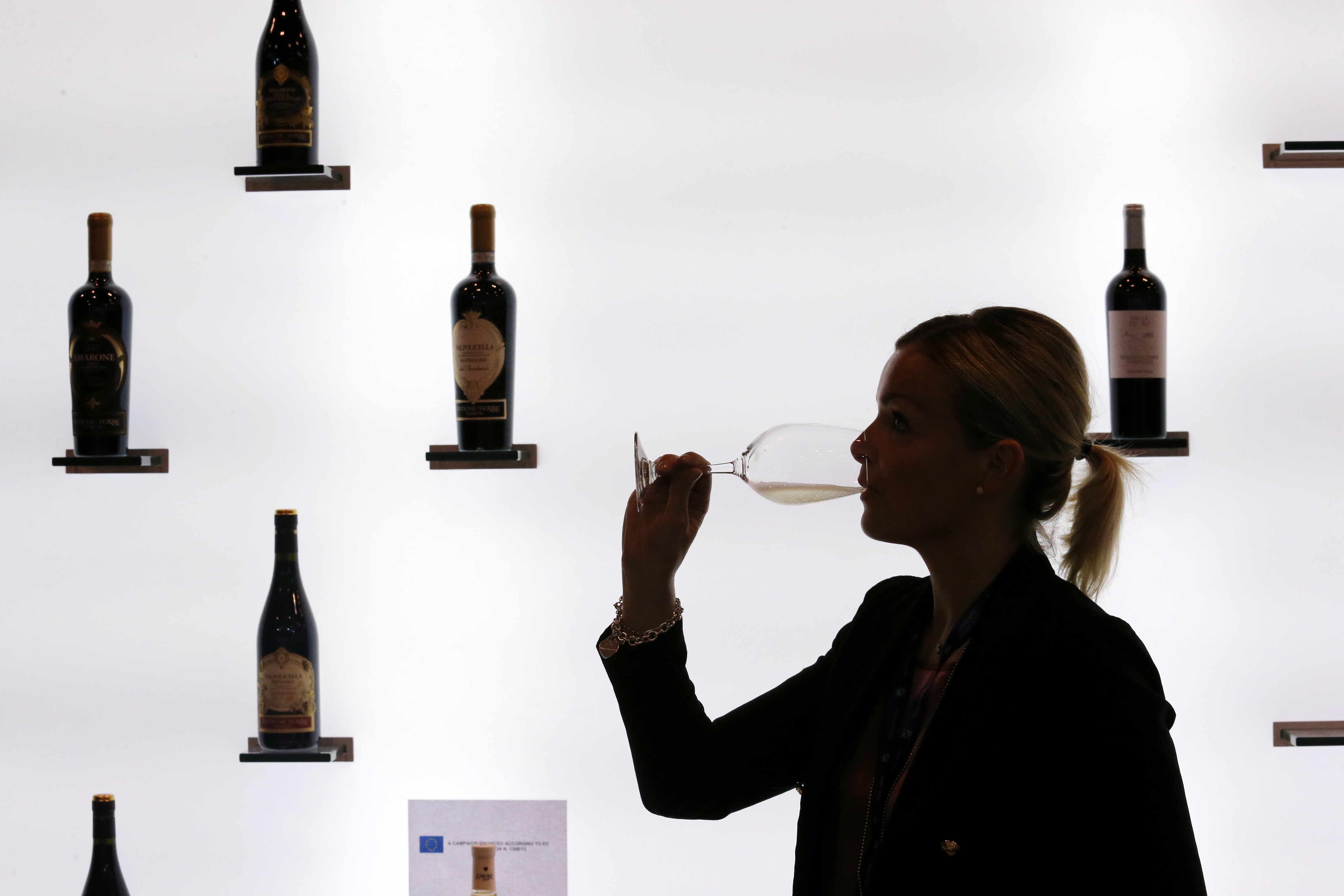 A visitor samples wine at Vinexpo, at the Hong Kong Convention and Exhibition Centre, in Wan Chai, on May 30, 2018. Hong Kong is the region’s trading hub for wines and spirits. Photo: Felix Wong