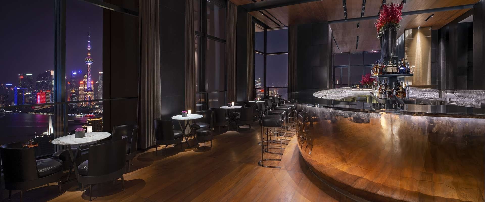 Il Bar in the new Bulgari Hotel Shanghai, China is a sleek space of polished wood and black leather furnishings.