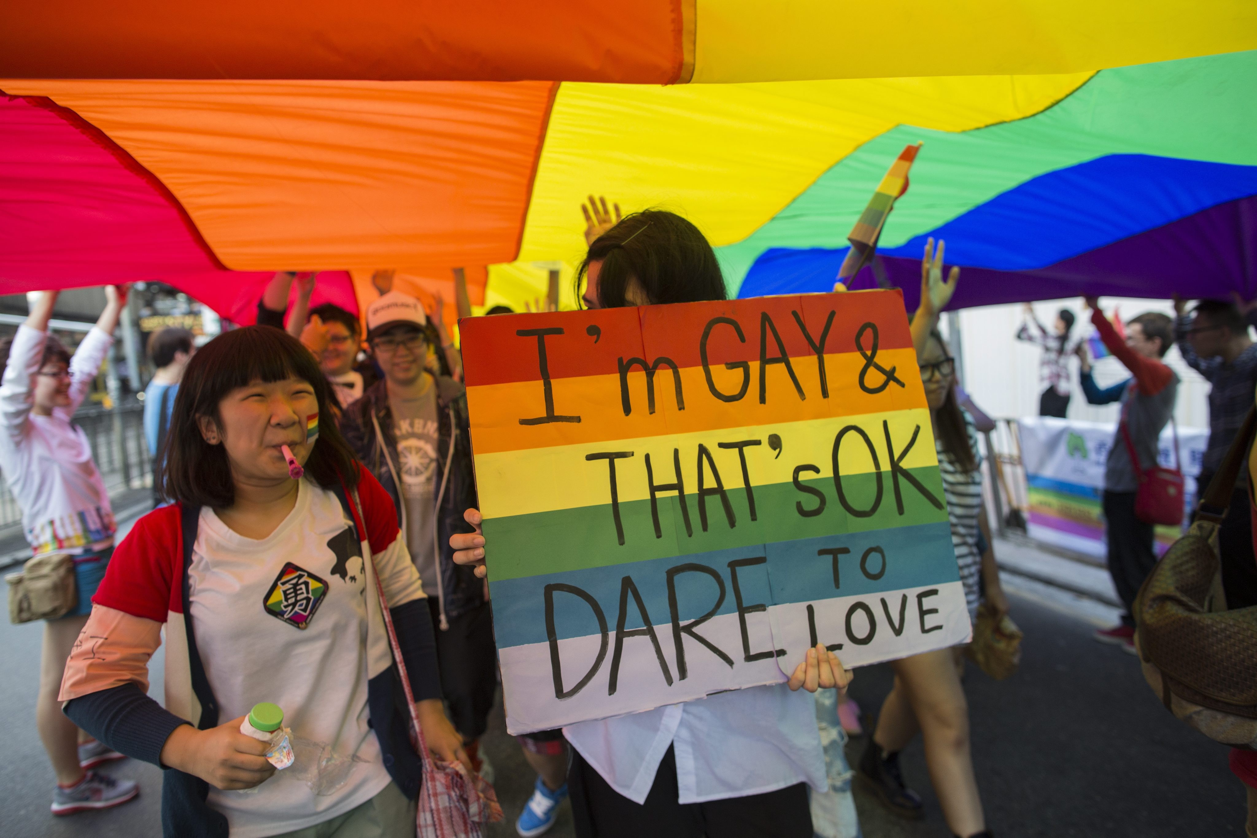 Marchers take part in the Hong Kong gay pride parade in November 2012. The lack of legal protection means members of Hong Kong’s LGBT community do not enjoy the same civil rights as their heterosexual peers. Photo: EPA