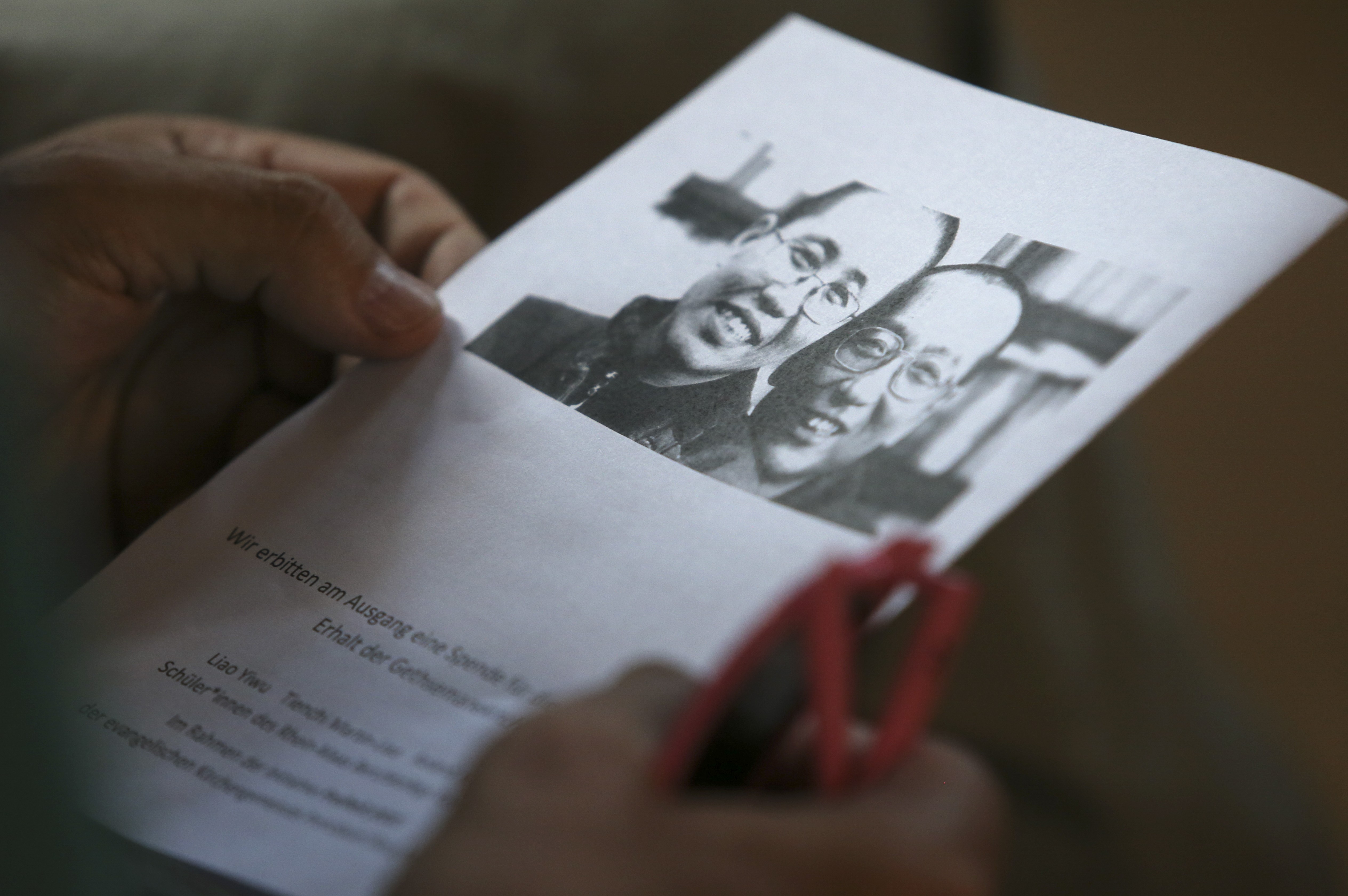 An order of service with a picture of Liu Xiaobo and Liu Xia on the cover. Photo: Sam Tsang