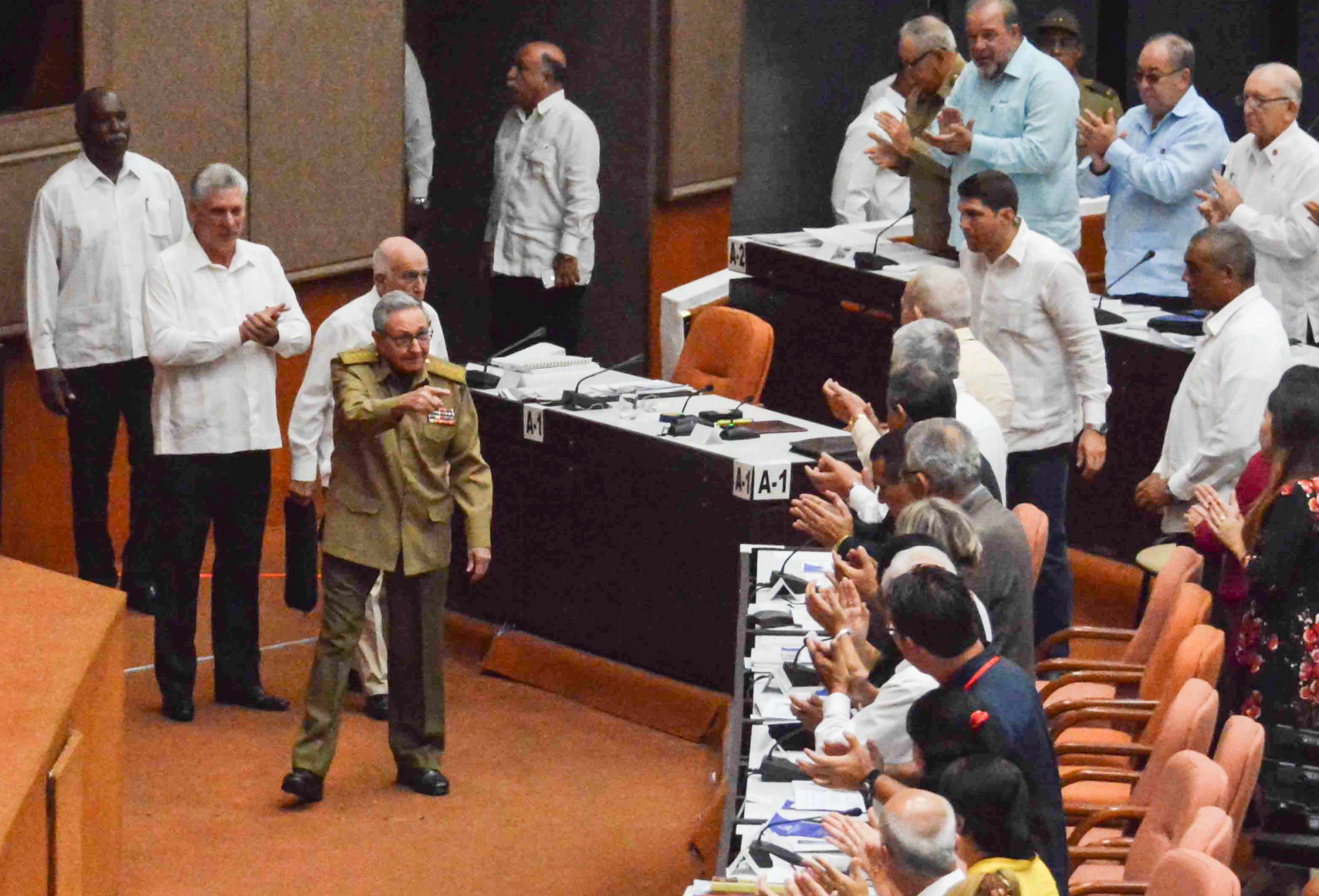Cuba’s President Miguel Diaz-Canel (second left) applauds as former president Raul Castro arrives at the National Assembly session on July 21, 2018. Photo: AFP