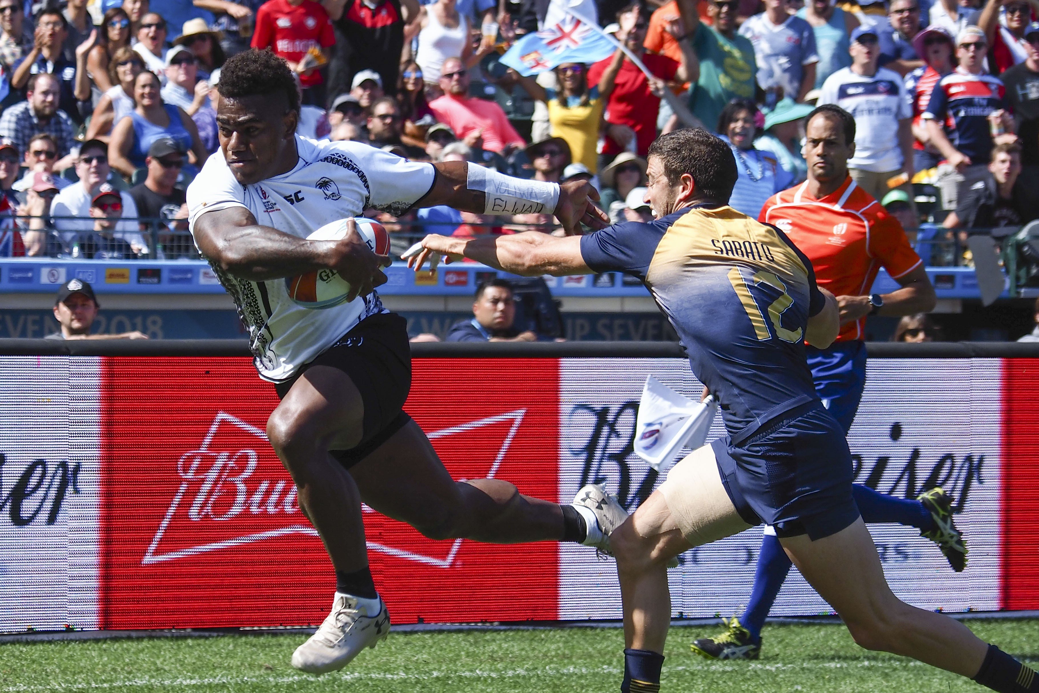 Josua Tuisova runs against Argentina’s Franco Sabato in the Rugby World Cup Sevens at AT&T Park. Photo: USA TODAY Sports
