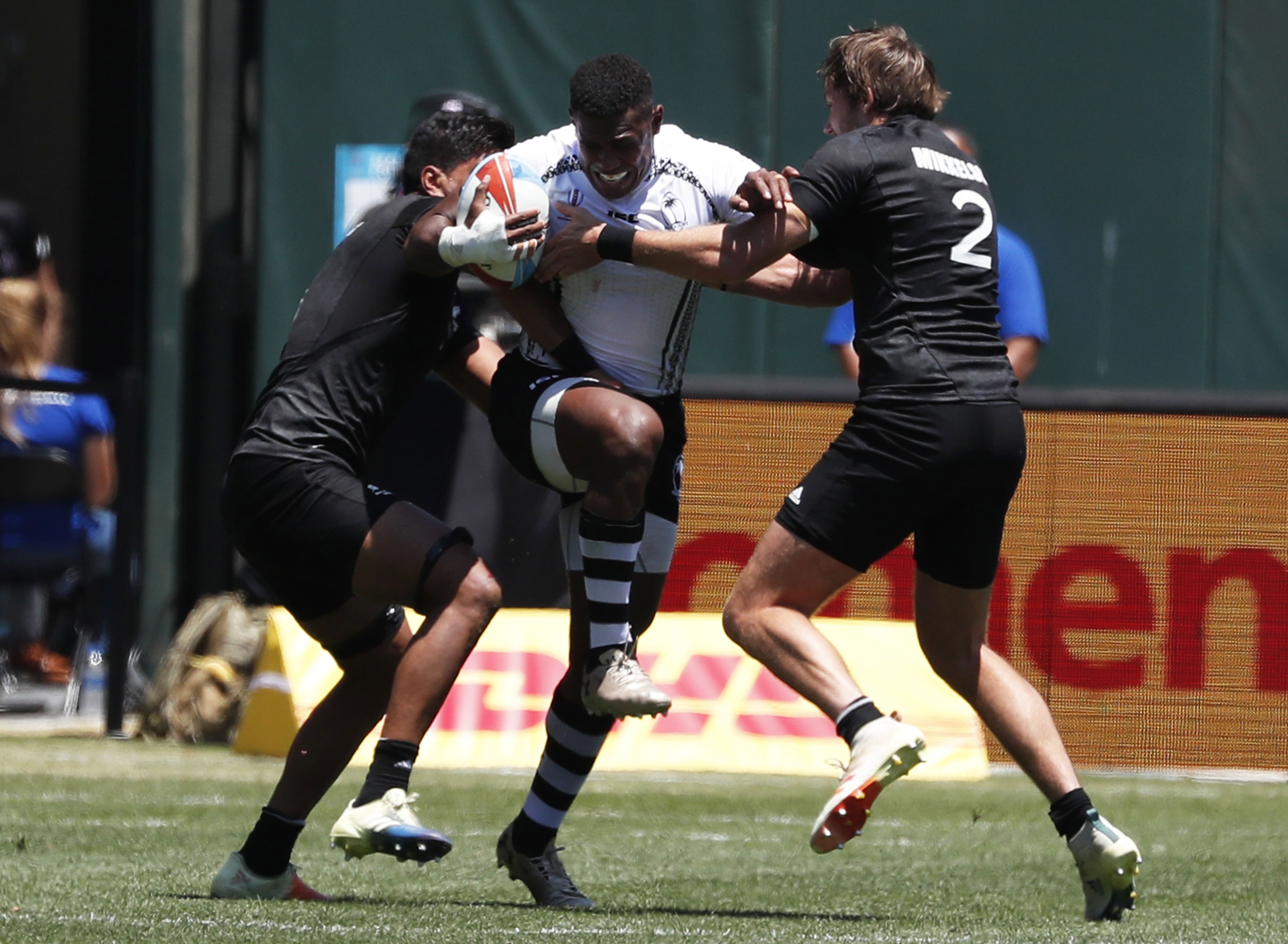 Fiji’s Kalione Nasoko is swamped by New Zealand’s Dylan Collier (left) and Tim Mikkelson. Photo: EPA