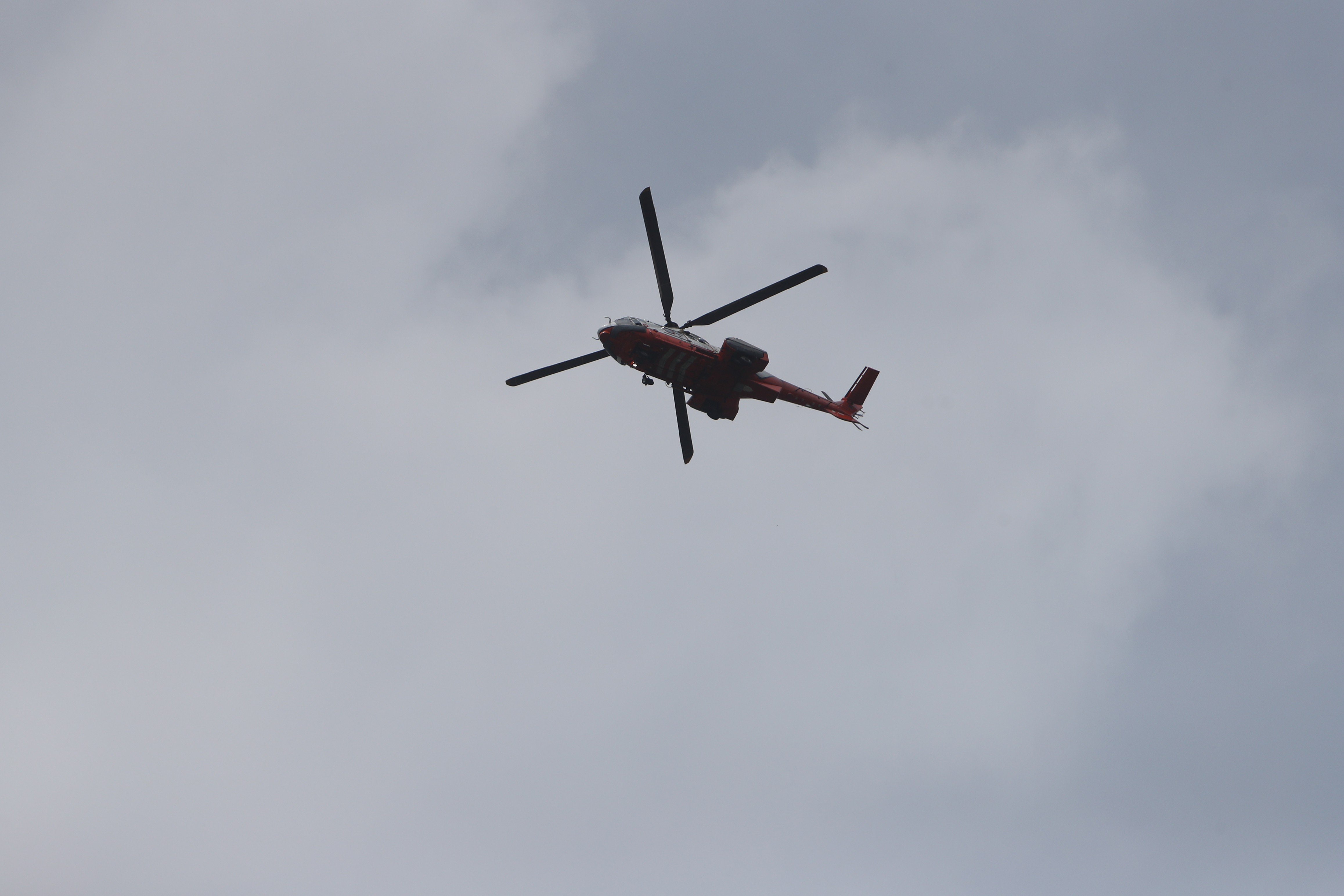 A fire department helicopter searches for Patrick Chung over Lantau Island on Tuesday. Photo: Winson Wong