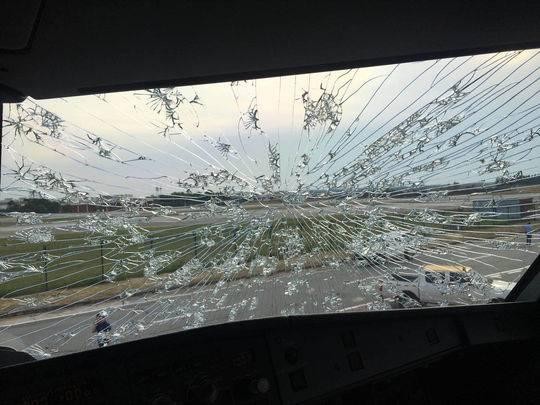 The windscreen was badly damaged after being hit by hailstones. Photo: Weibo