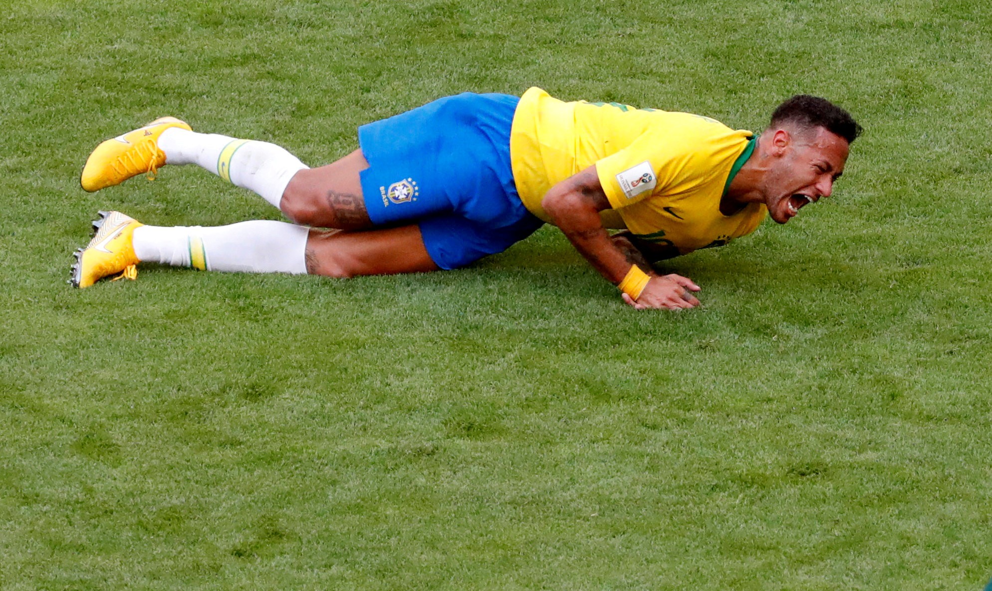 Neymar lies on the pitch in match against Mexico. Photo: Reuters
