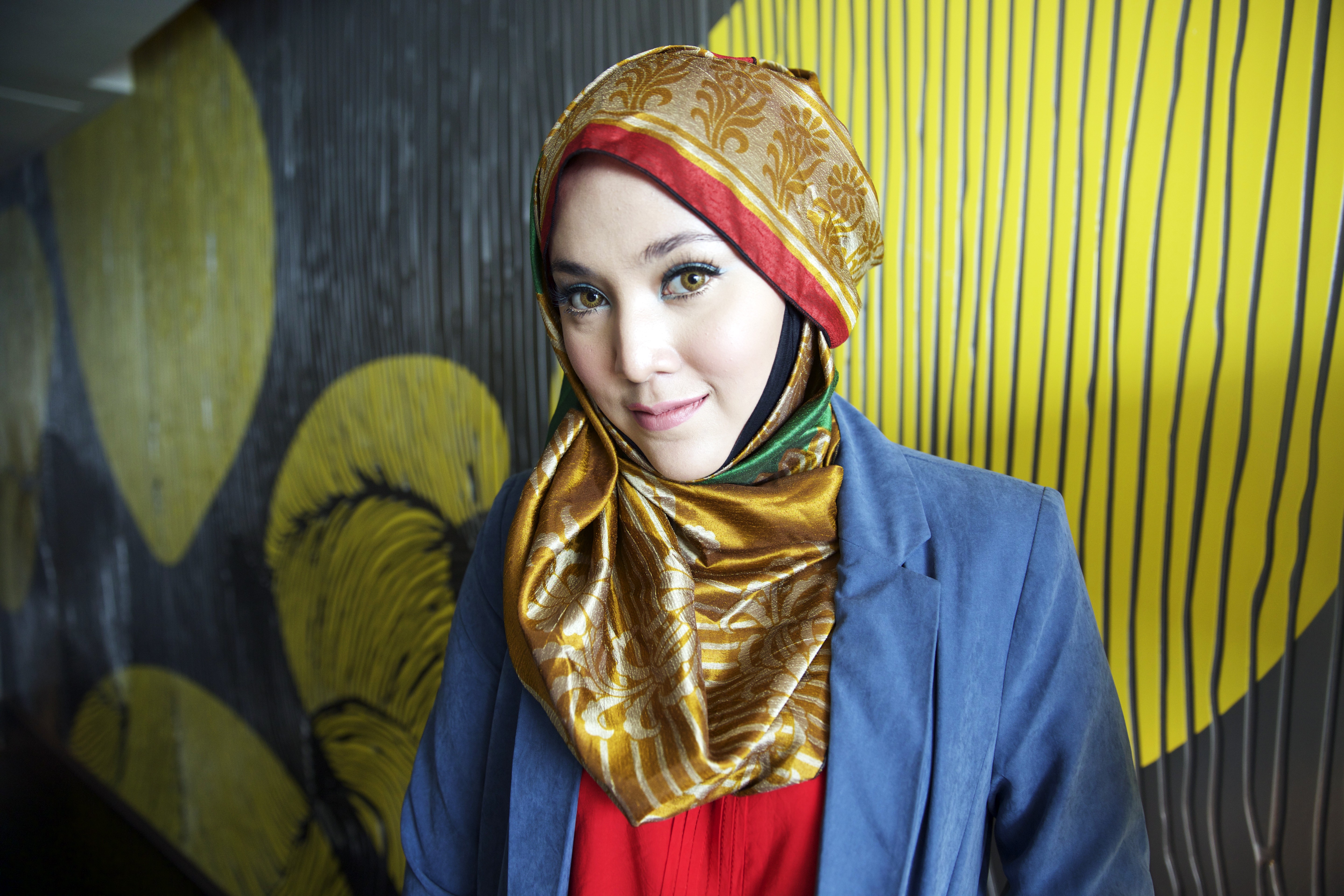 Shila Amzah is a fashion inspiration for millions of young Muslim women worldwide. Her colourful hijabs are a refreshing counterpoint to her international outlook. Photo: Vicky Feng