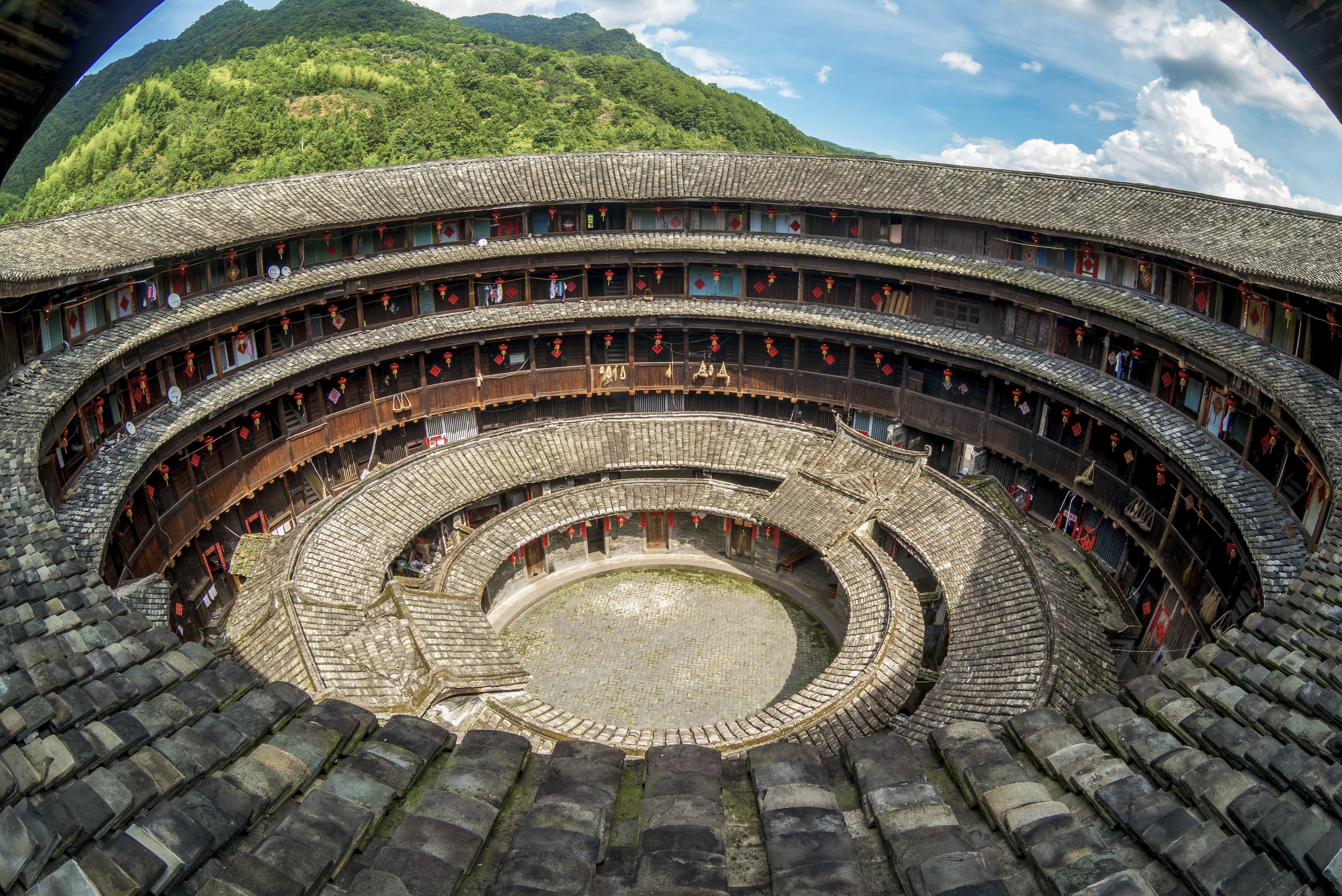 Forty-six doughnut-shaped roundhouses in Fujian have been awarded Unesco World Heritage status, but roughly 3,000 others are in a state of decay. One returnee is now trying to revive his childhood home and community