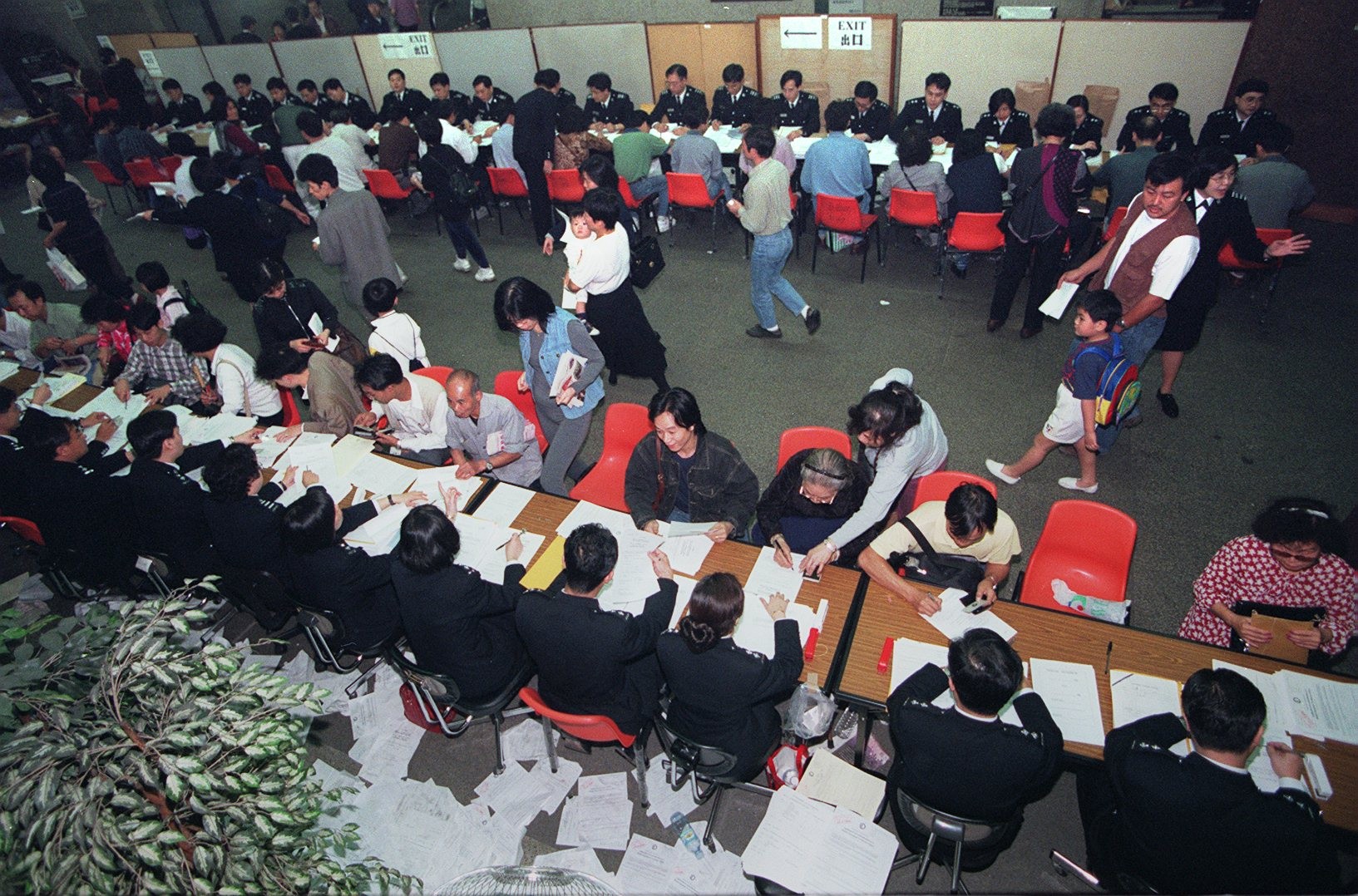 Immigration Department officers in Hong Kong process BN(O) passport applications in March 1996. Hong Kong ceased to be a British colony as of July 1, 1997. Photo: SCMP