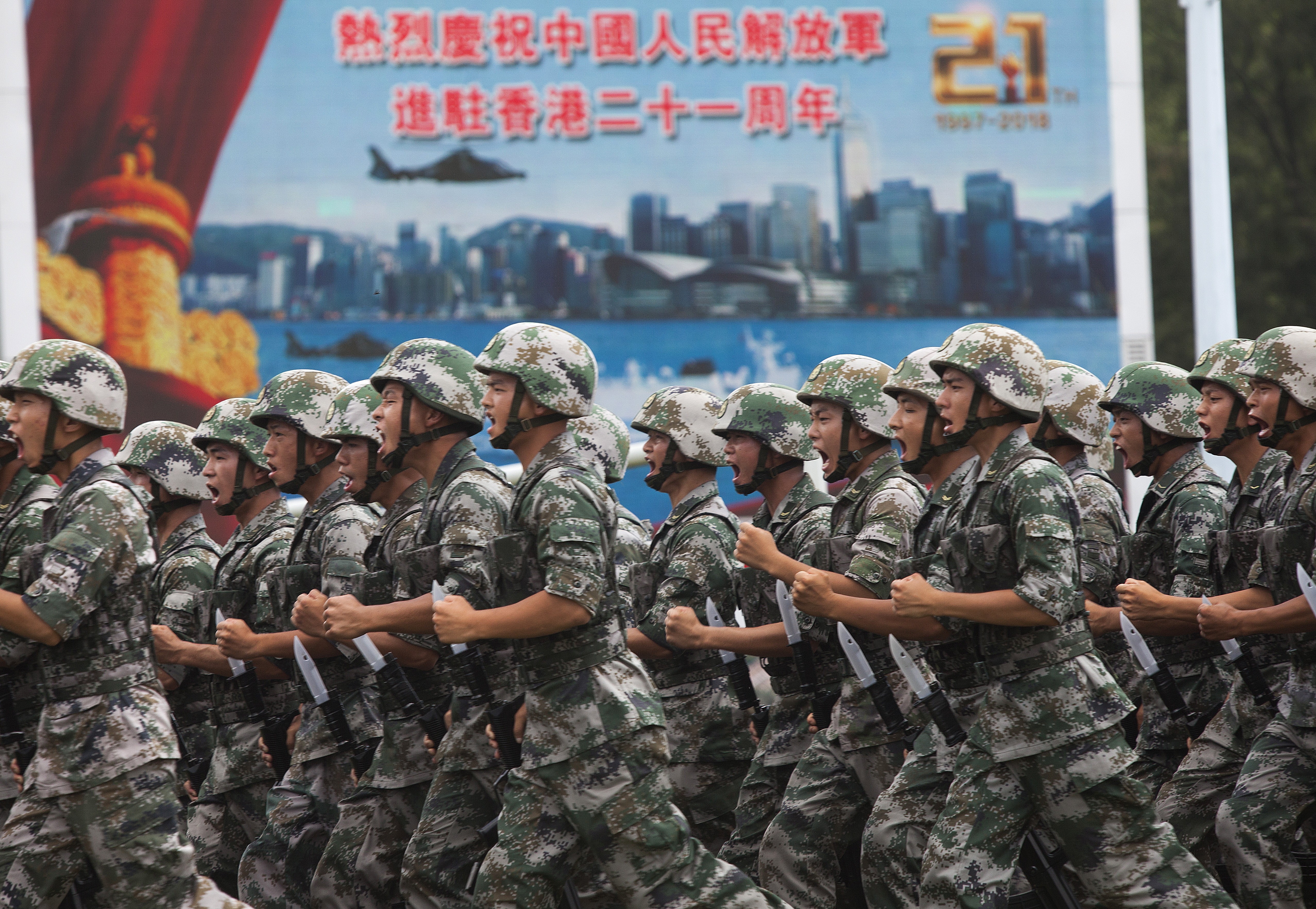 Soldiers demonstrate combat exercises at a PLA barracks open day to mark the 21st anniversary of Hong Kong’s return to China, at the Ngong Shuen Chau naval base in Kowloon, on July 1. Photo: EPA