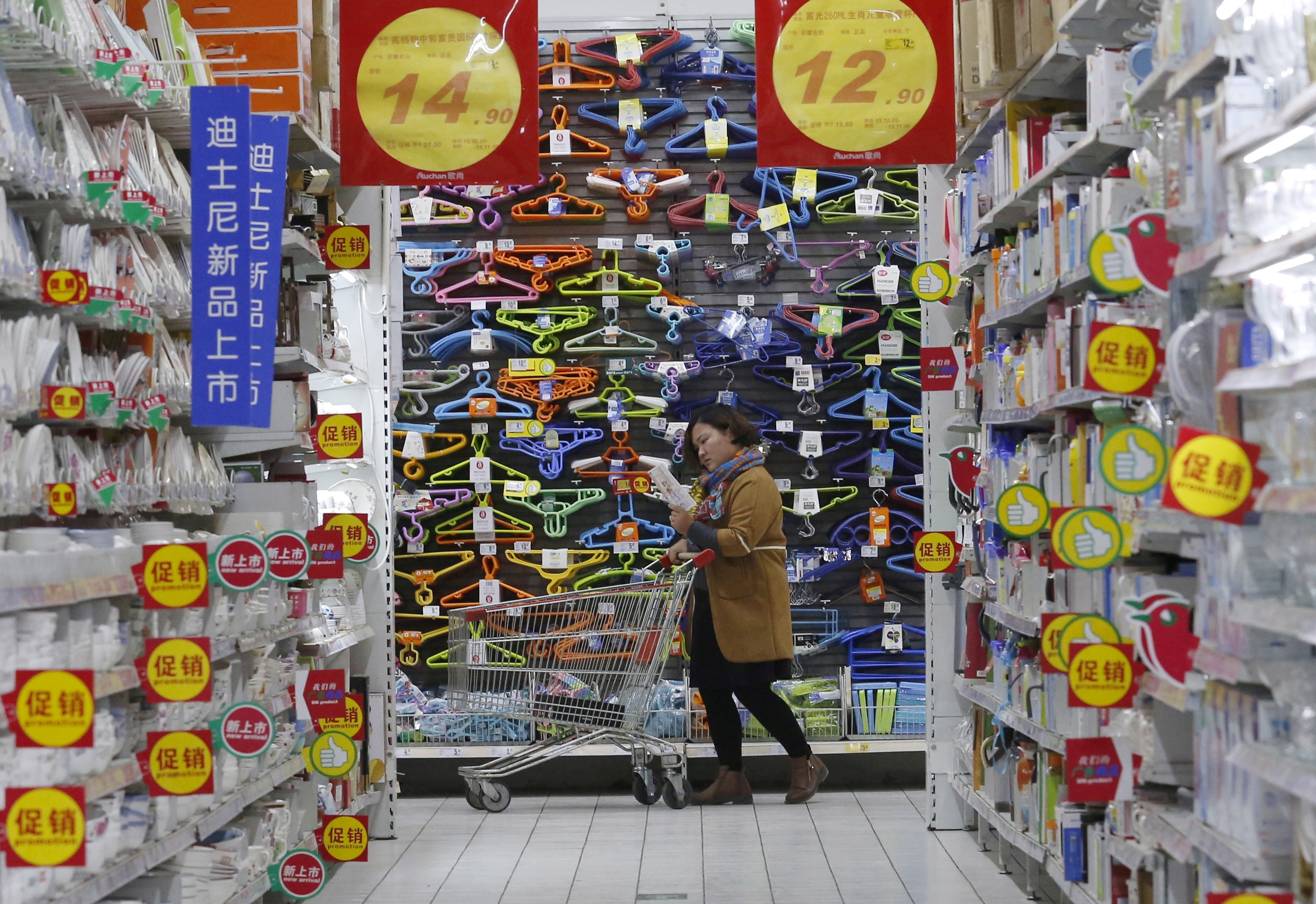 A shopper in Beijing. Figures showed falling sales at major Chinese retailers in July. Photo: Reuters