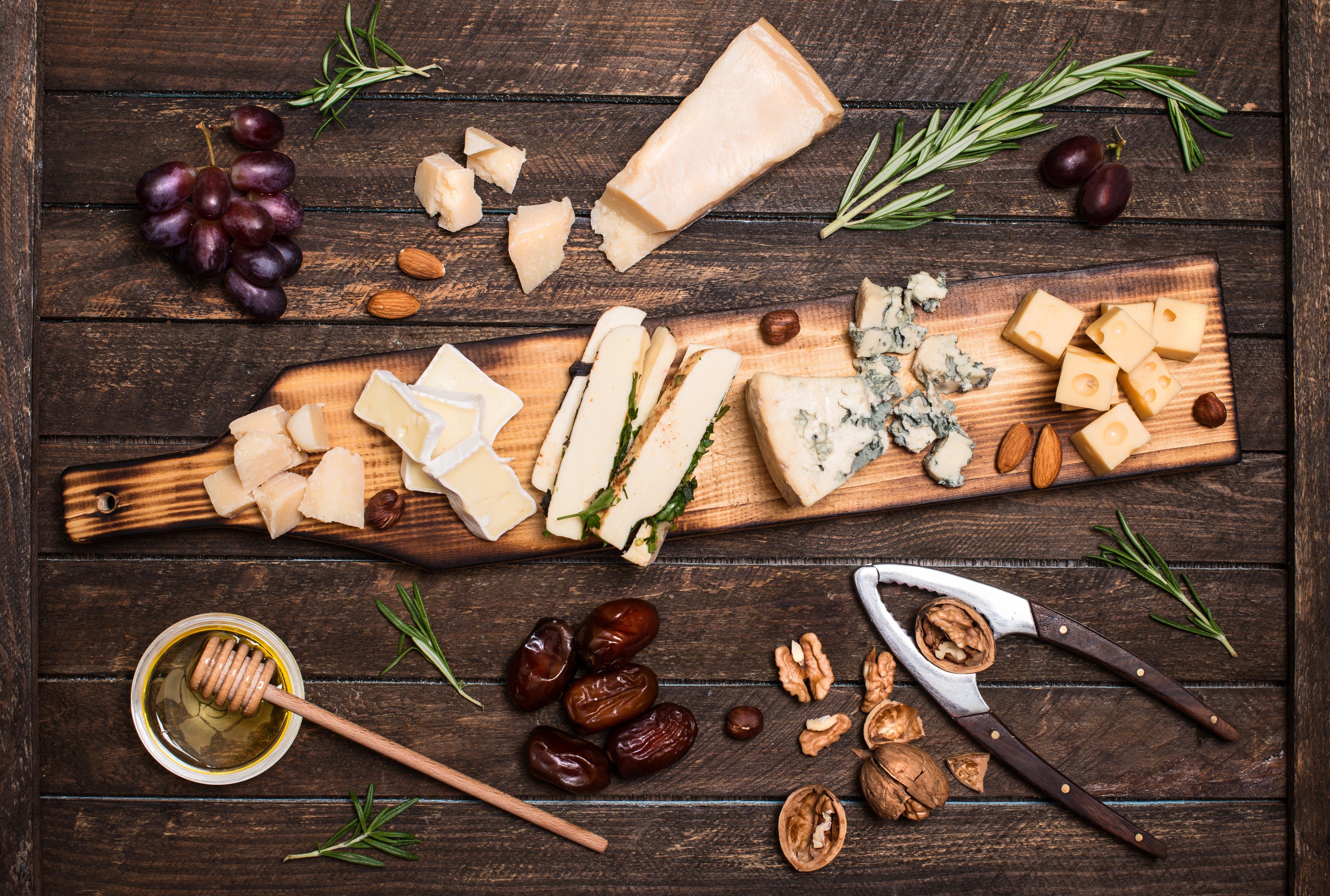Many cheese lovers opt for a cheese platter instead of dessert. Different types of cheese should be accompanied by different kinds of wine, and grapes, nuts, honey, bread and dates are perfect complements to cheeses. Photo: Thinkstock