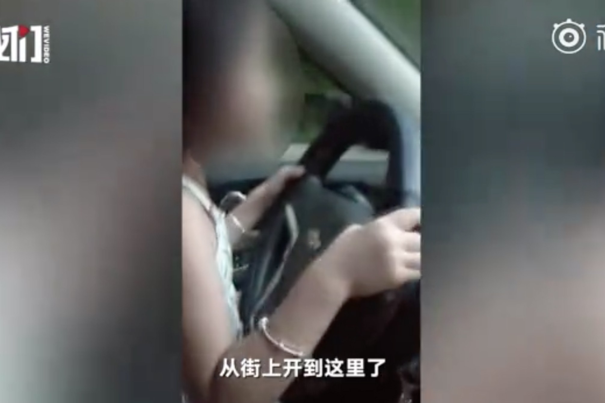 A couple from central China were detained and fined for allowing their six-year-old daughter steer their car. Source: Miaopai