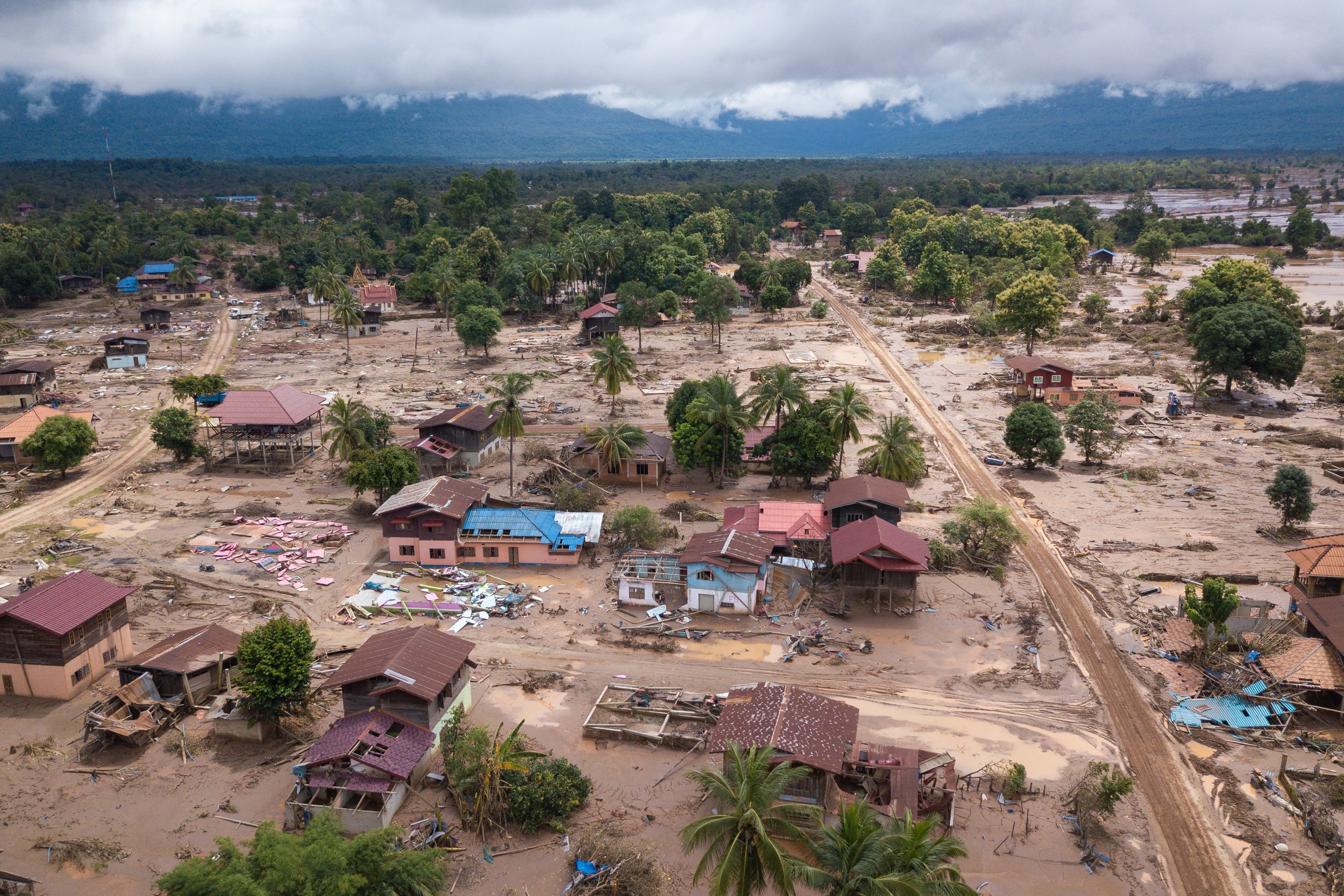 On July 23, floodwaters from a failed dam swallowed entire villages, killing 39 people and displacing thousands. Are innocent villagers paying the price for country’s ambitious dream of becoming the ‘battery of Asia’?