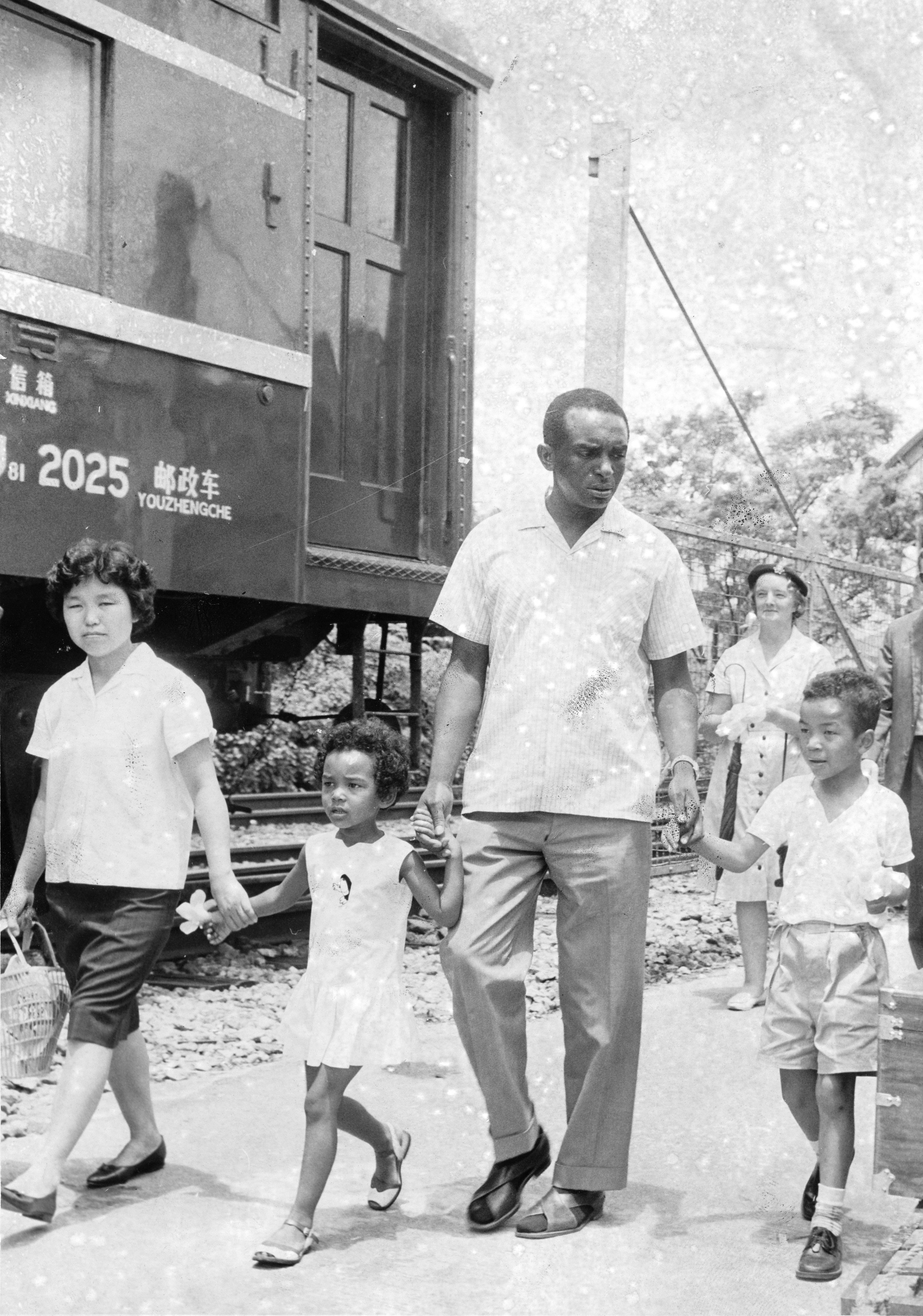 Former US soldier William White and his family crossing the border into Hong Kong at Lo Wu in August 1965.