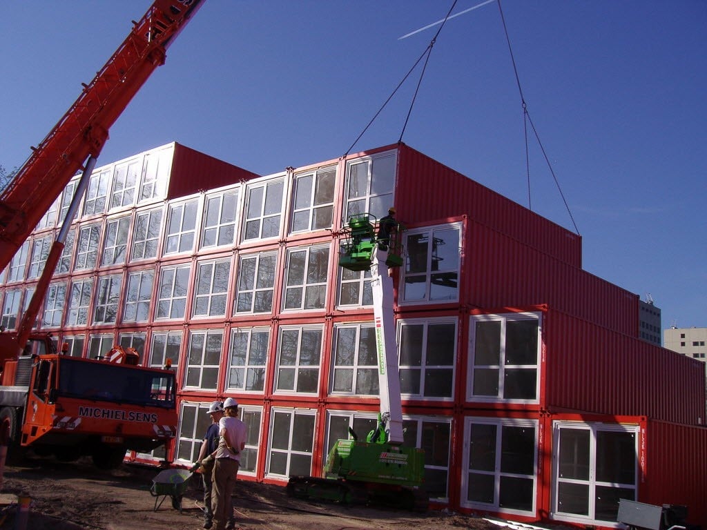 Prefabricated housing units being unloaded by crane in Amsterdam. Could they be part of the solution in Hong Kong? Photo: Tempohousing