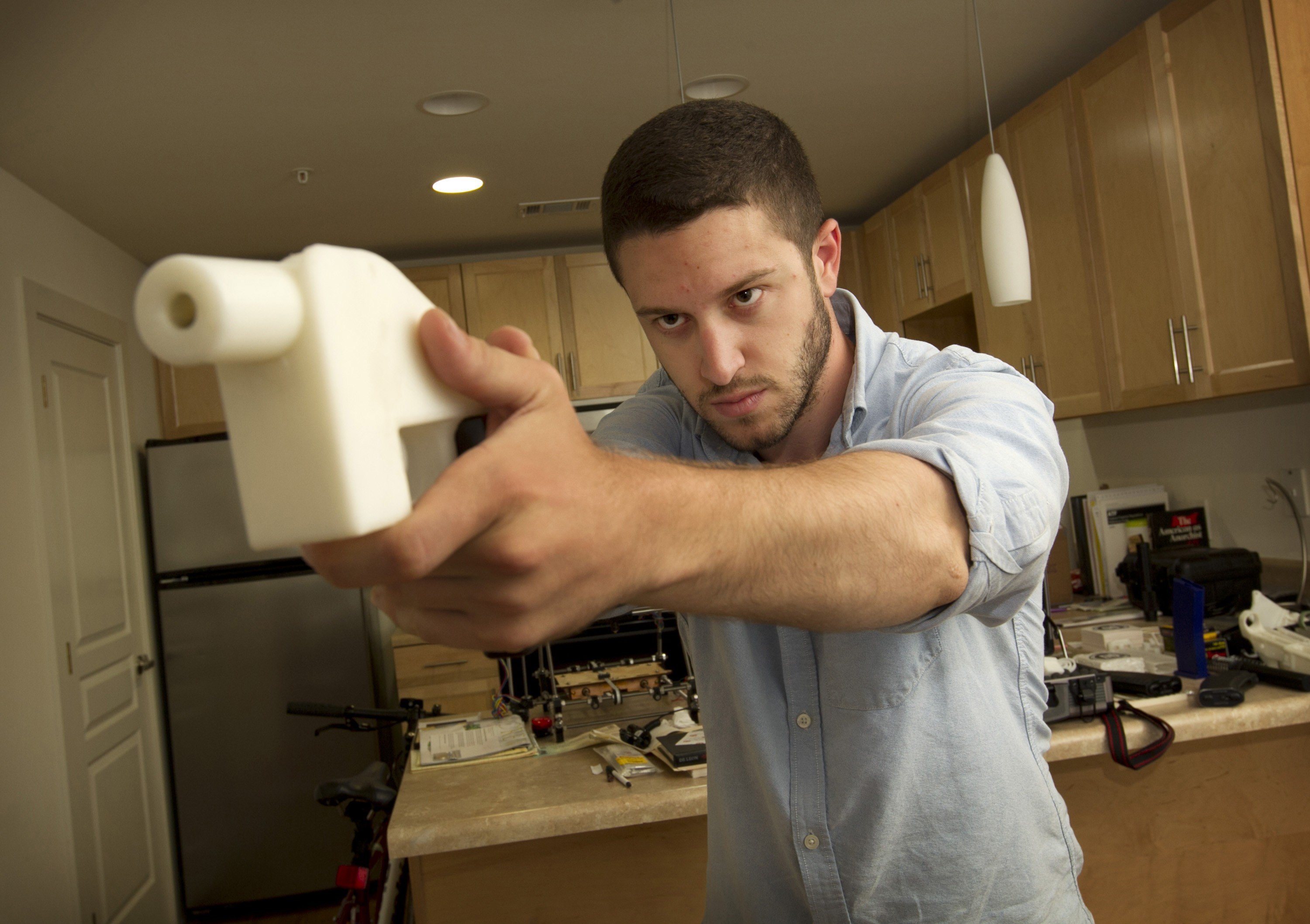 Cody Wilson with a 3D-printed handgun, The Liberator, at his home in Austin, Texas. Photo: TNS