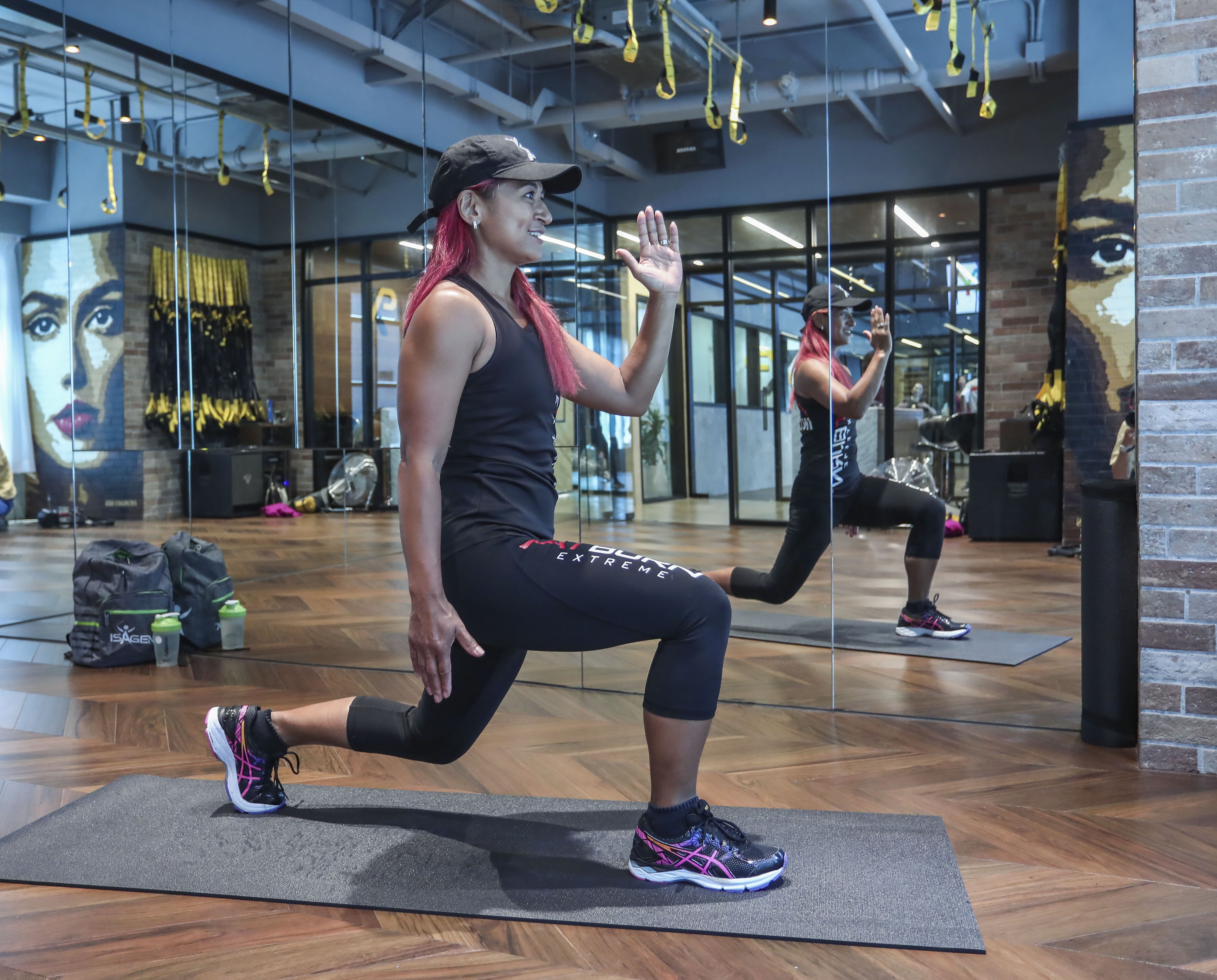 Hong Kong personal trainer Angela Hancock doing lunges at XP Fitness Hub in Central. Photo: Jonathan Wong