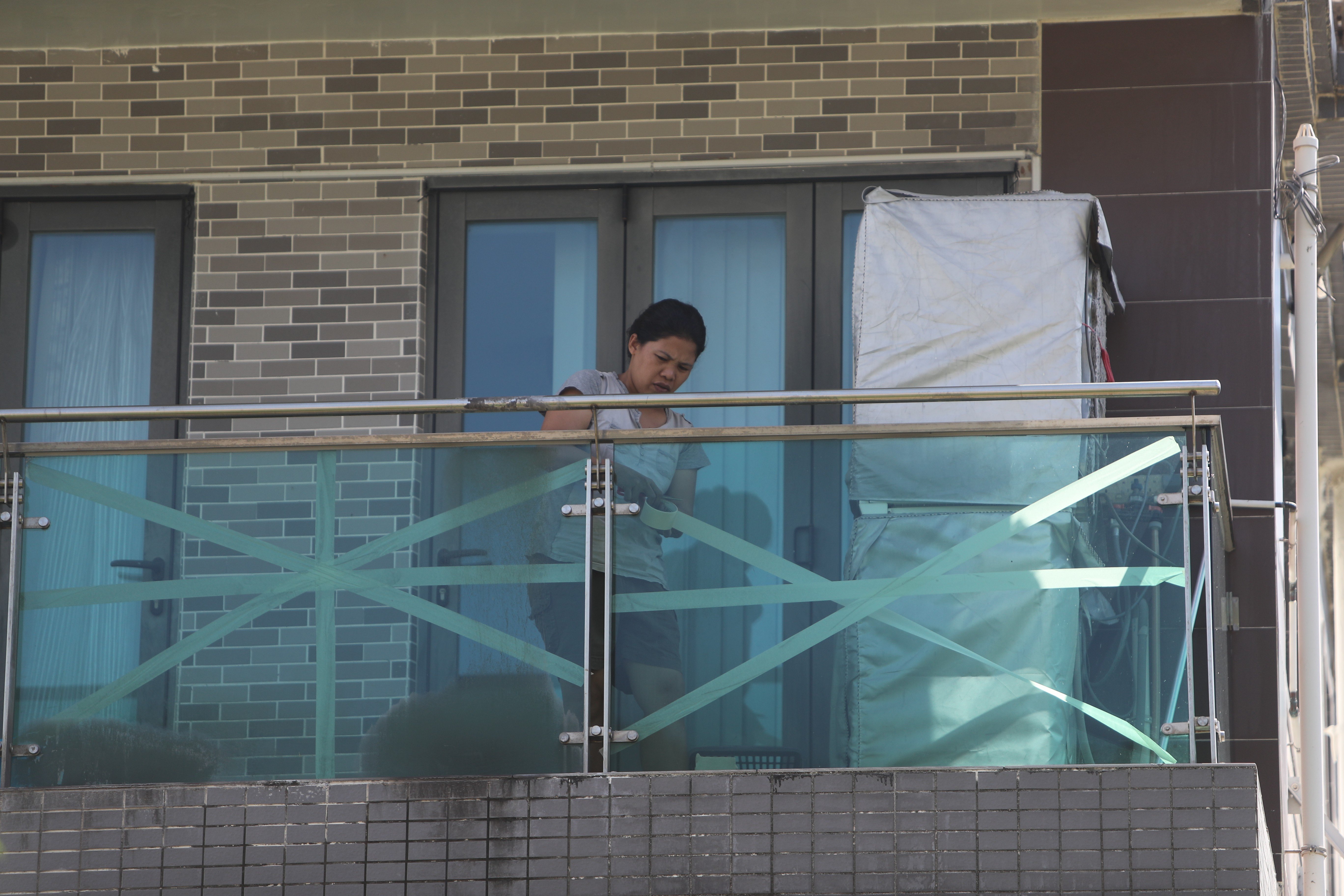 Experts are split on the benefits of taping windows ahead of storms. Photo: Winson Wong