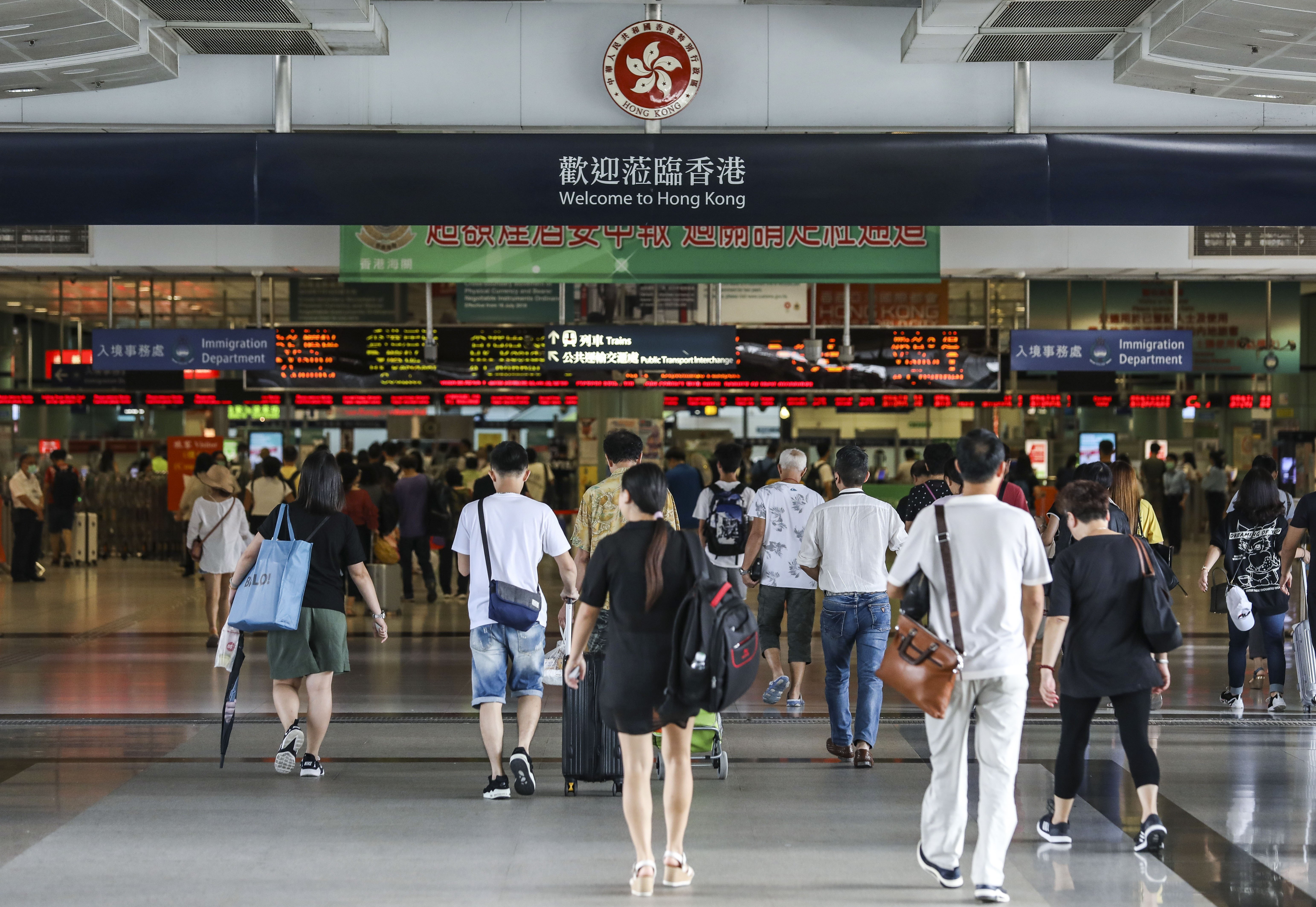 People cross the Lok Ma Chau border station from Shenzhen into Hong Kong on September 4. Photo: Roy Issa