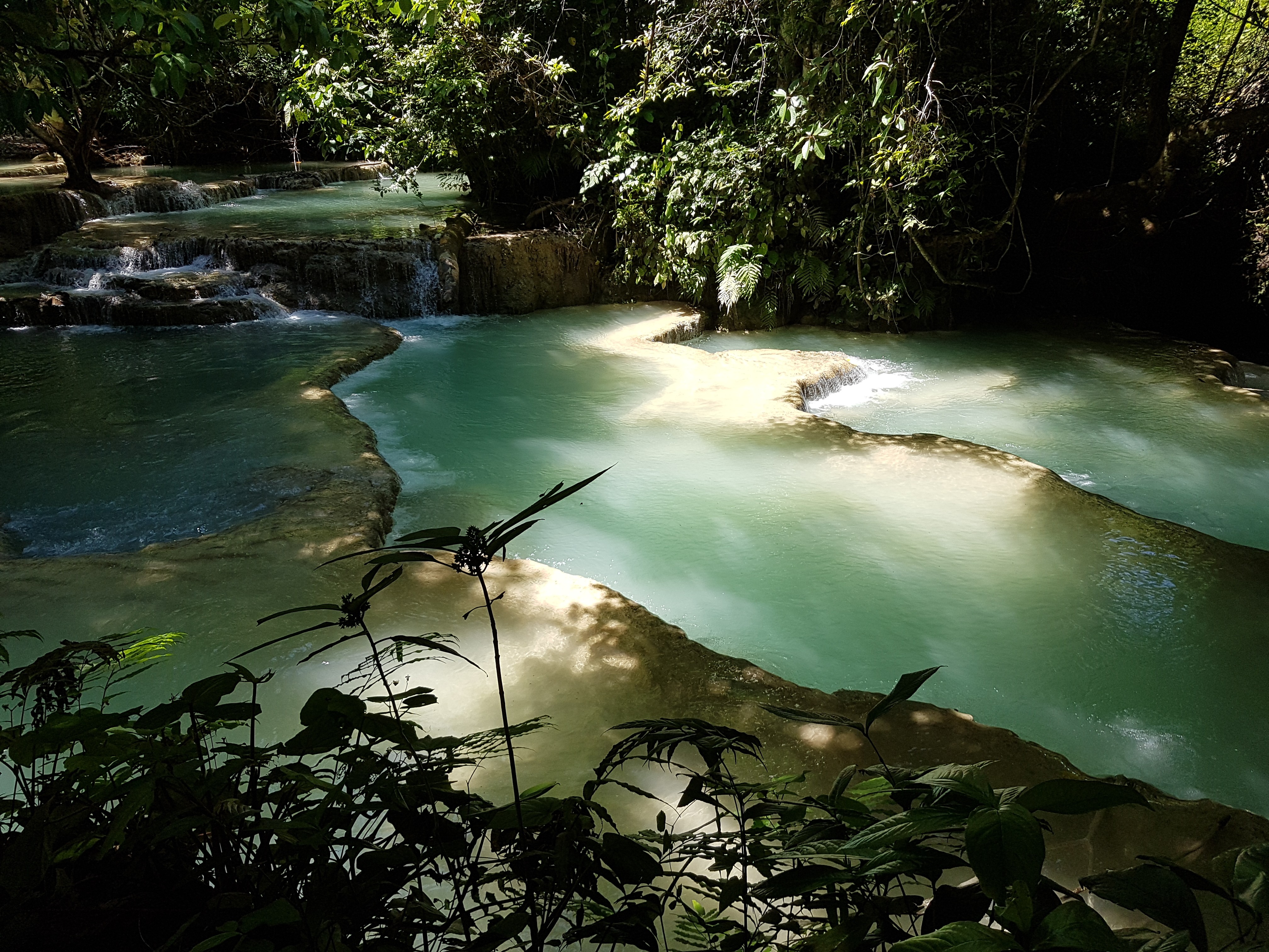 The rich green hues of the gently flowing cascades at Kuang Si Falls. Photos: Cedric Tan