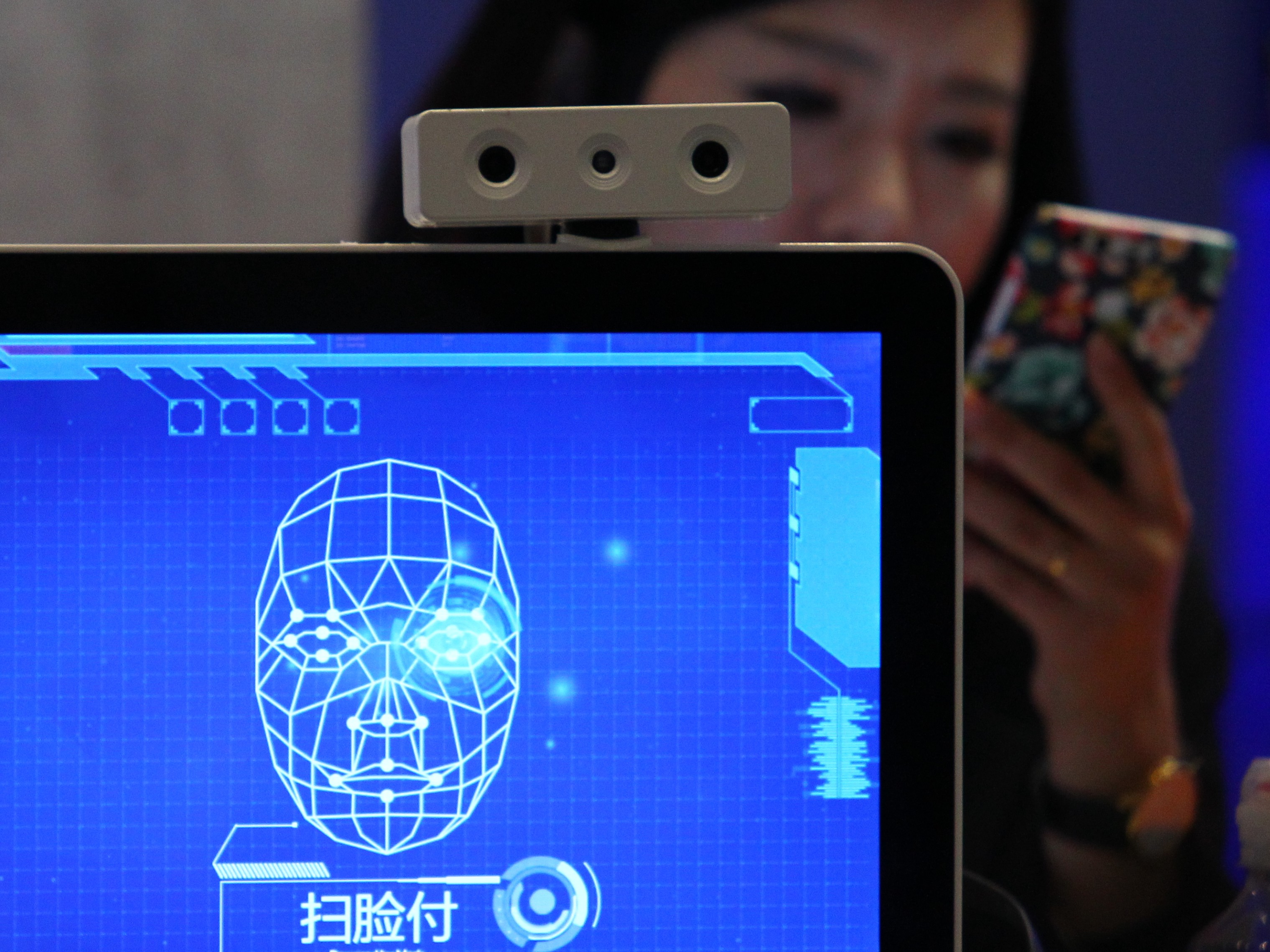 An artificial intelligence system backed by facial recognition which can used in mobile payments is demonstrated at the 3rd World Internet Conference Wuzhen Summit on November 26, 2016. Photo: Simon Song