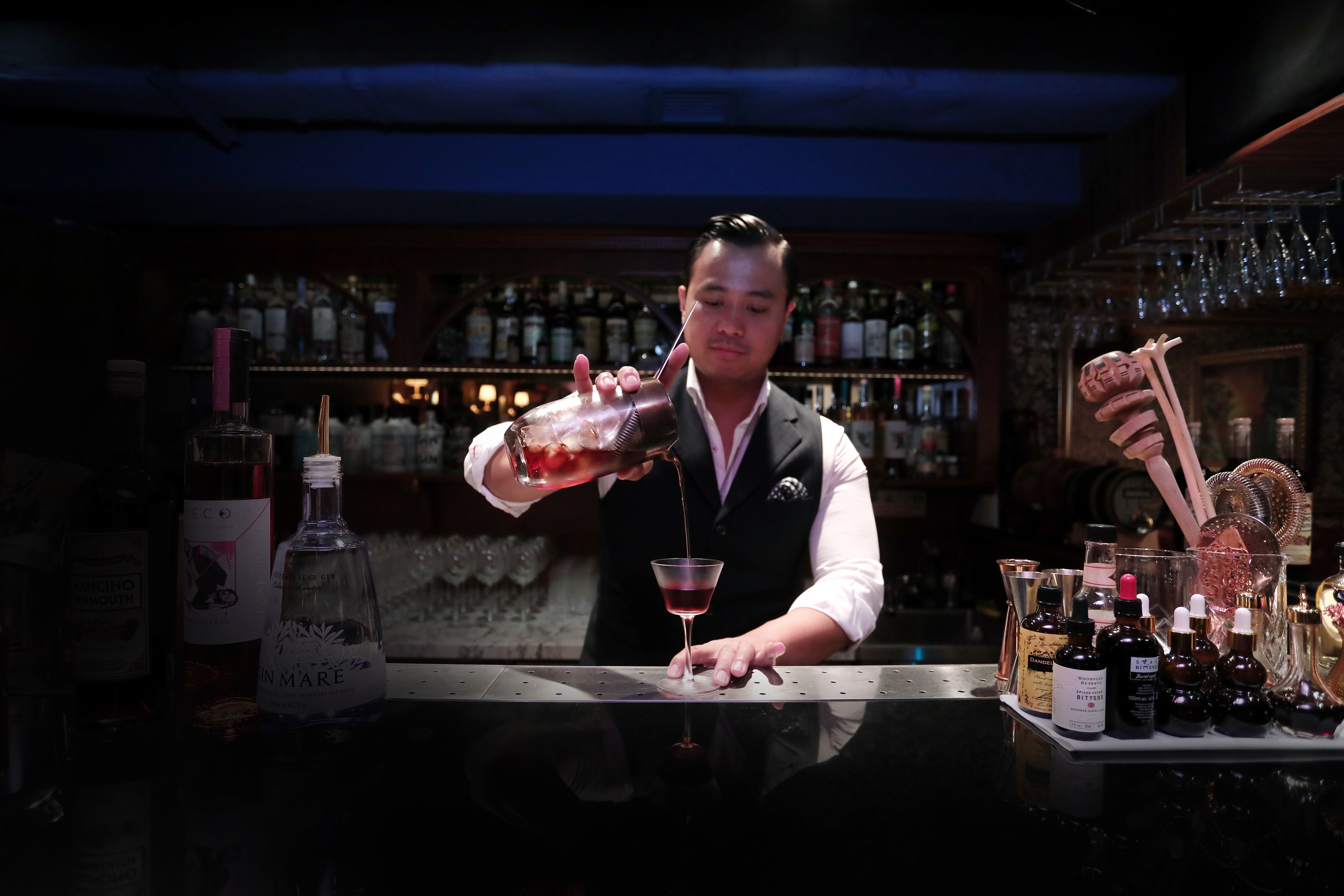 Joe Villanueva mixes a monti-tipple, a cocktail based on the original martinez, at The Wise King, in Central. Picture: Jonathan Wong