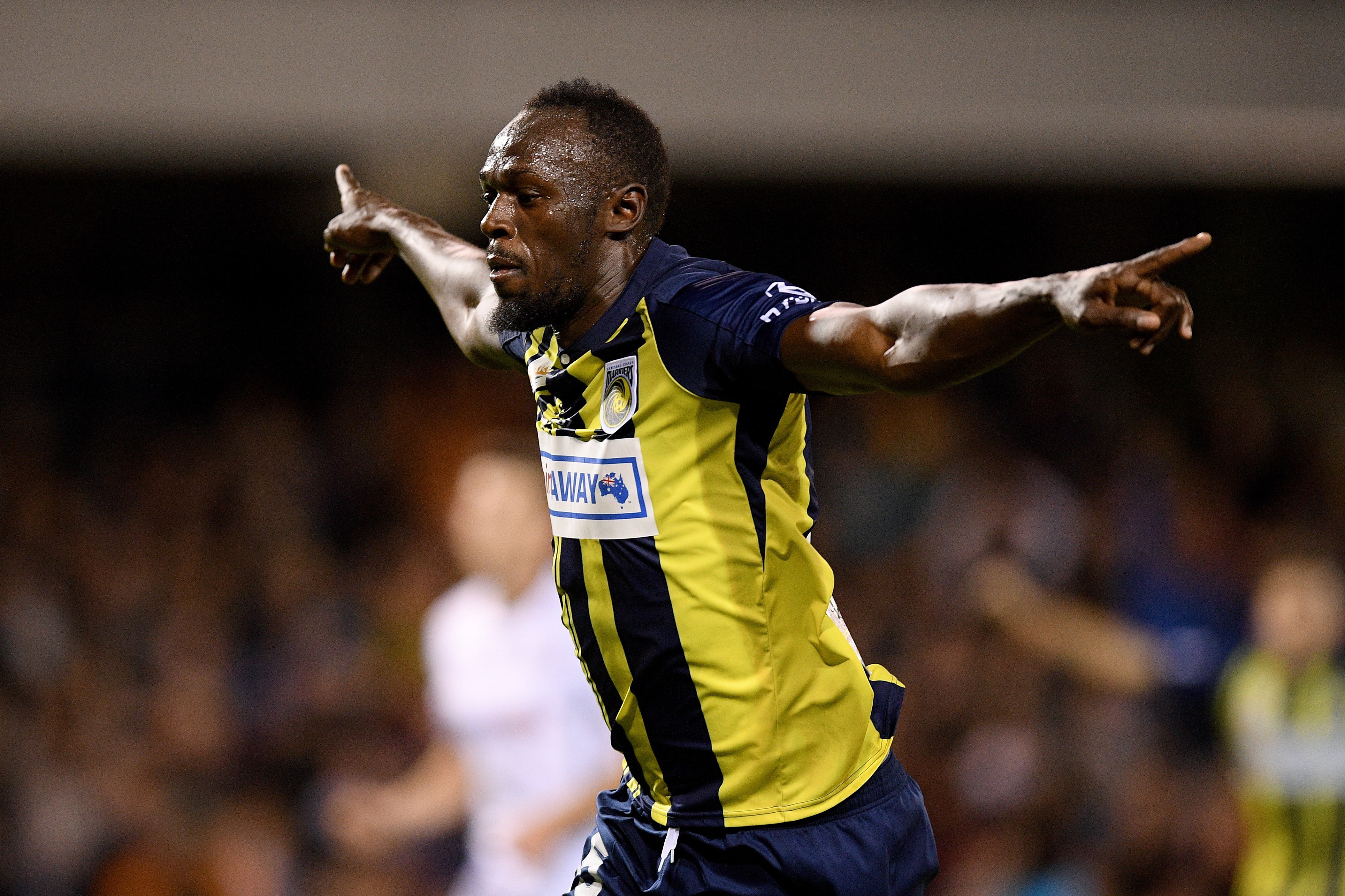Usain Bolt celebrates scoring for Central Coast Mariners. Photos: EPA