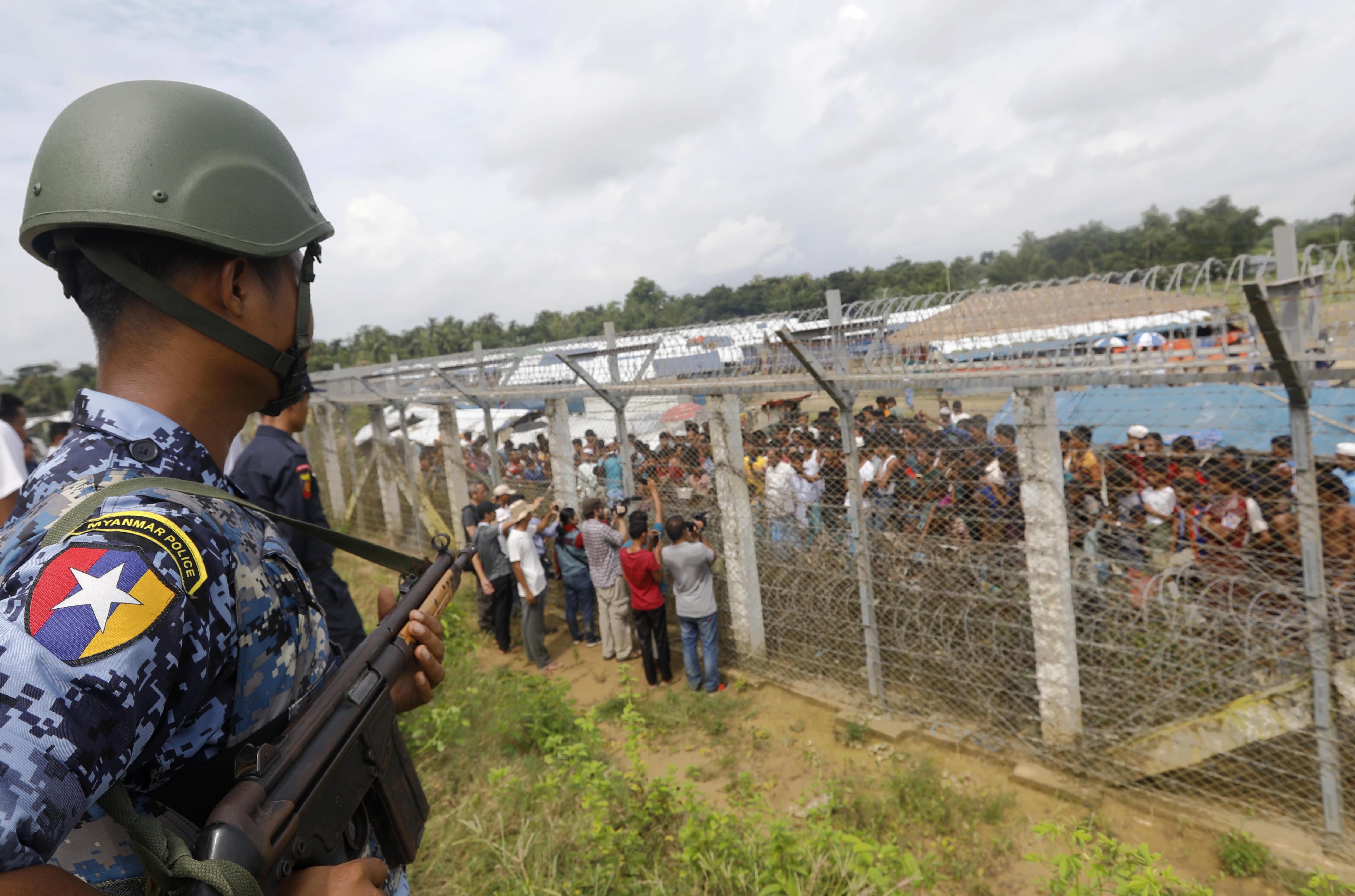 A Myanmar border guard watches the ‘no-man’s-land’ zone between Bangladesh and Myanmar in Rakhine State. Photo: EPA