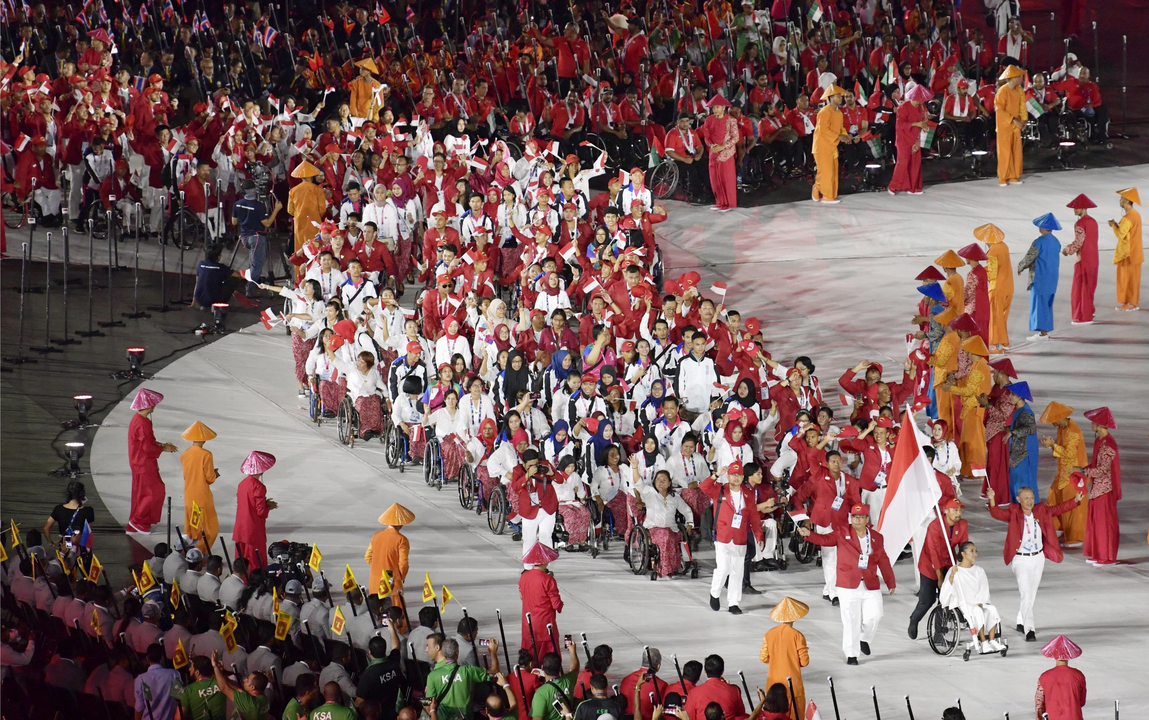 Indonesian athletes enter the Gelora Bung Karno Stadium in Jakarta for the opening ceremony of the Asian Para Games. Photo: Kyodo
