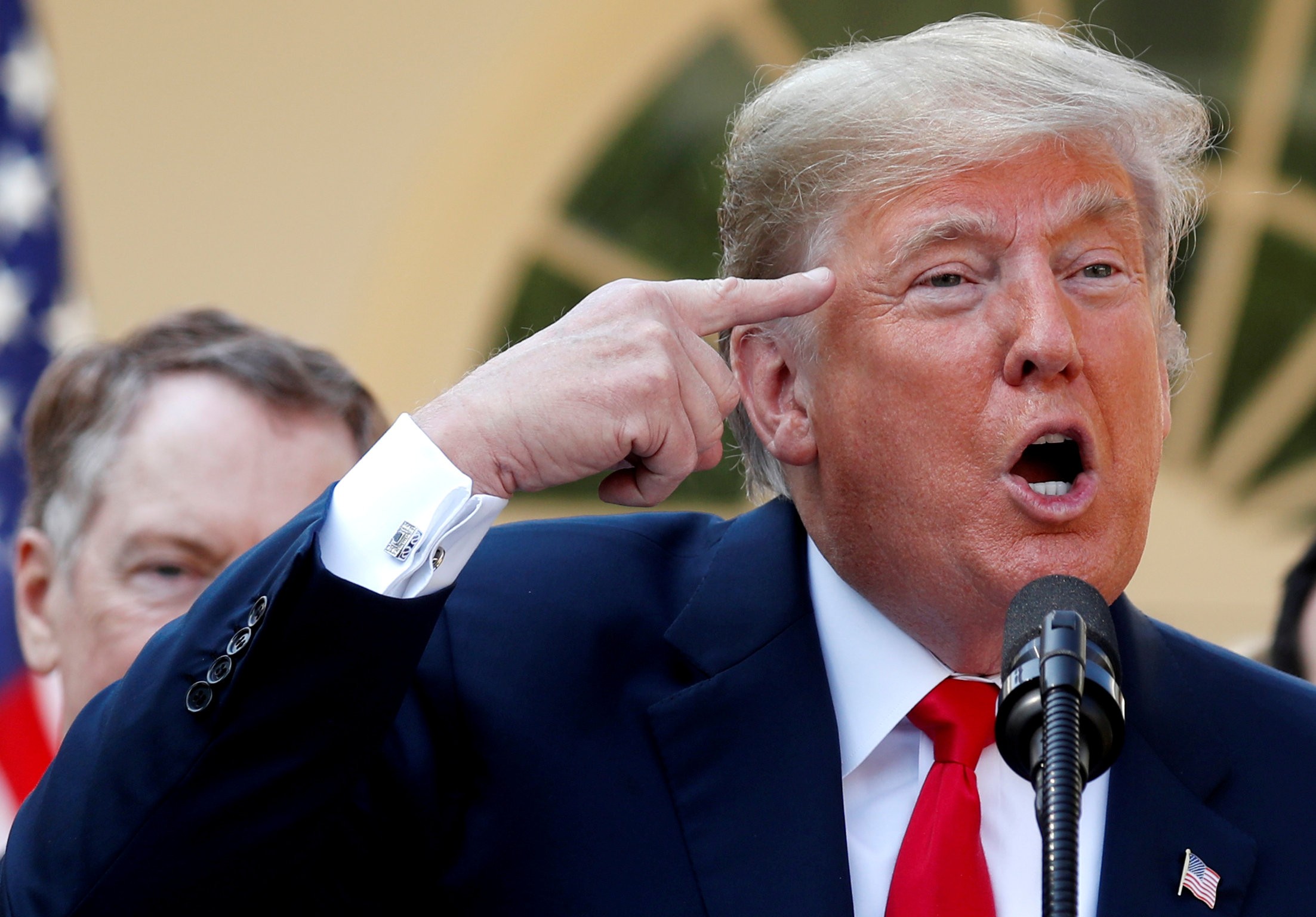 US President Donald Trump delivers remarks on the United States-Mexico-Canada Agreement as US Trade Representative Robert Lighthizer listens during a news conference at the White House in Washington on October 1. Photo: Reuters