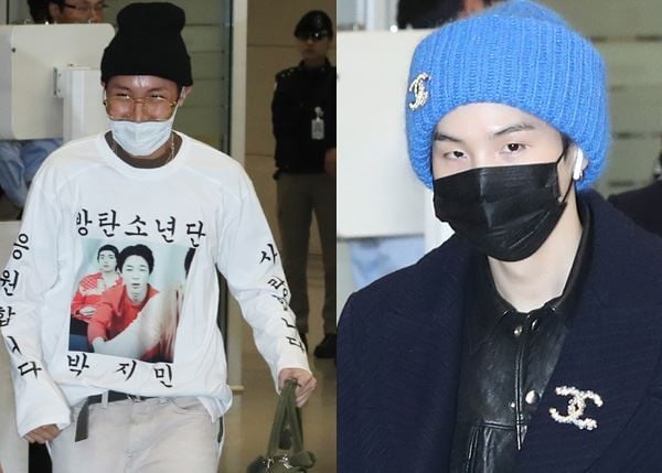 BTS members J-Hope (left) and Suga wear masks at Incheon International Airport on Tuesday after the boy band arrived back in South Korea after performing concerts in North America and Europe as part of its world tour. Photo: Yonhap