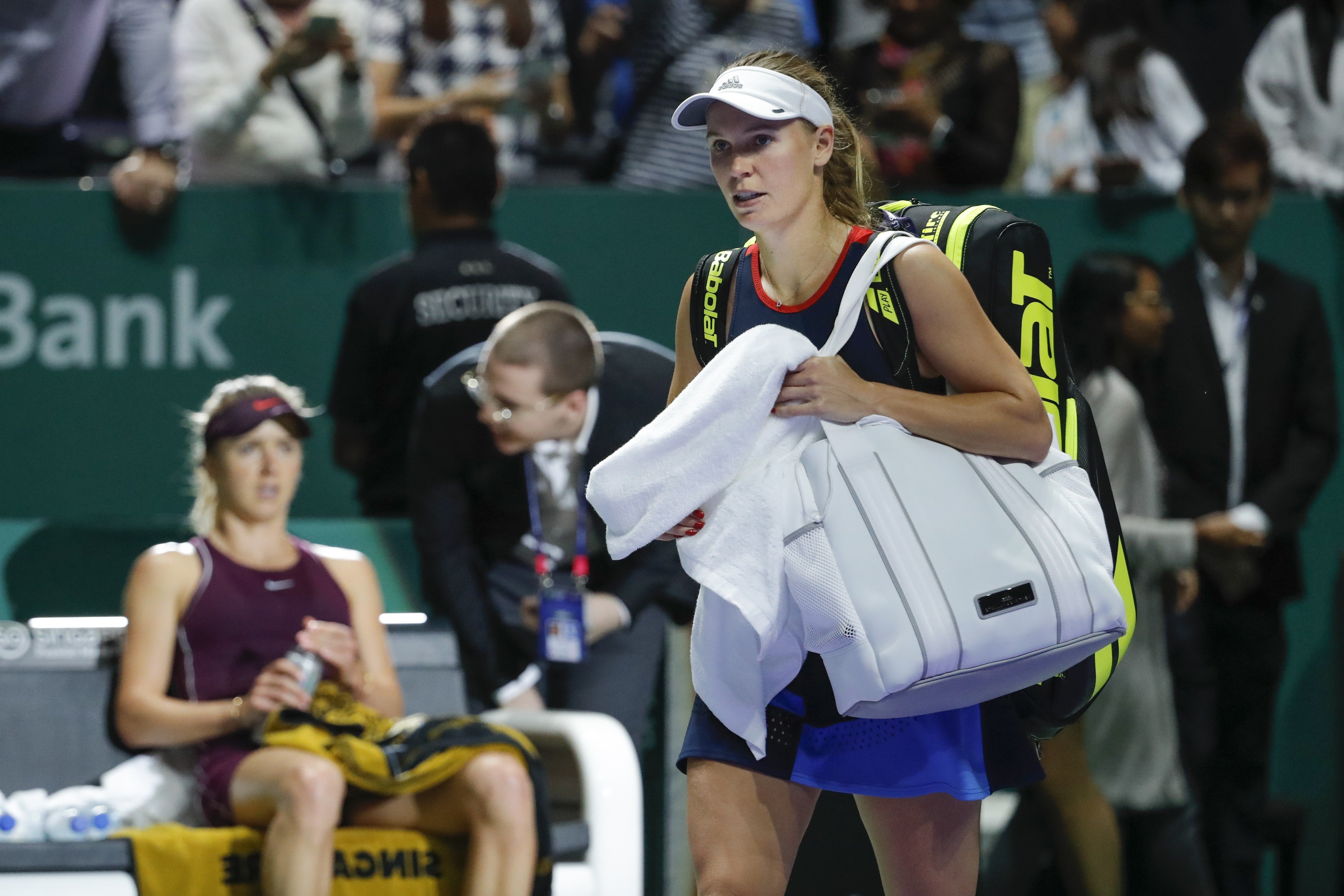 Caroline Wozniacki leaves after losing to Elina Svitolina at the WTA Finals in Singapore. Photo: AP