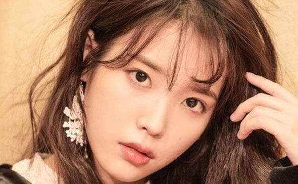 K-pop star IU, whose new single, ‘BBI BBI’, is doing well in the pop charts, says a number of people, claiming financial hardship, have sent her messages on social media asking for money. Photo: Kakao M