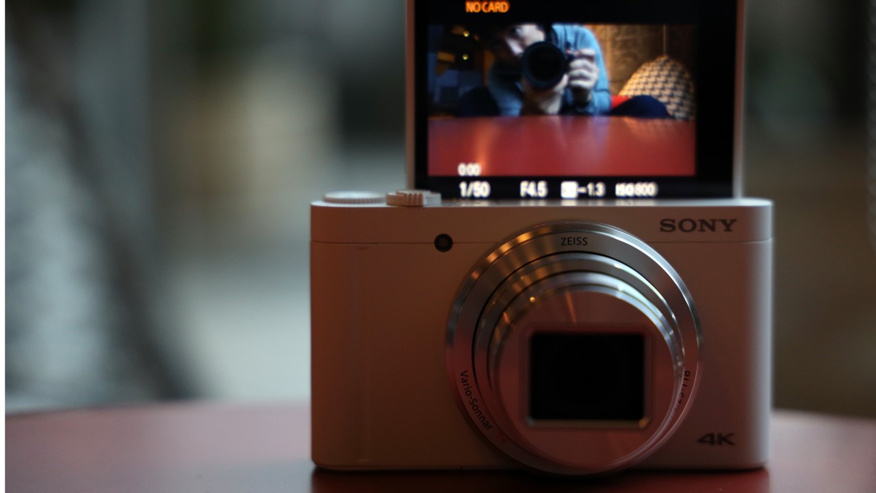 Pocket-sized Sony DSC-WX800 digital camera's zoom lens packs a