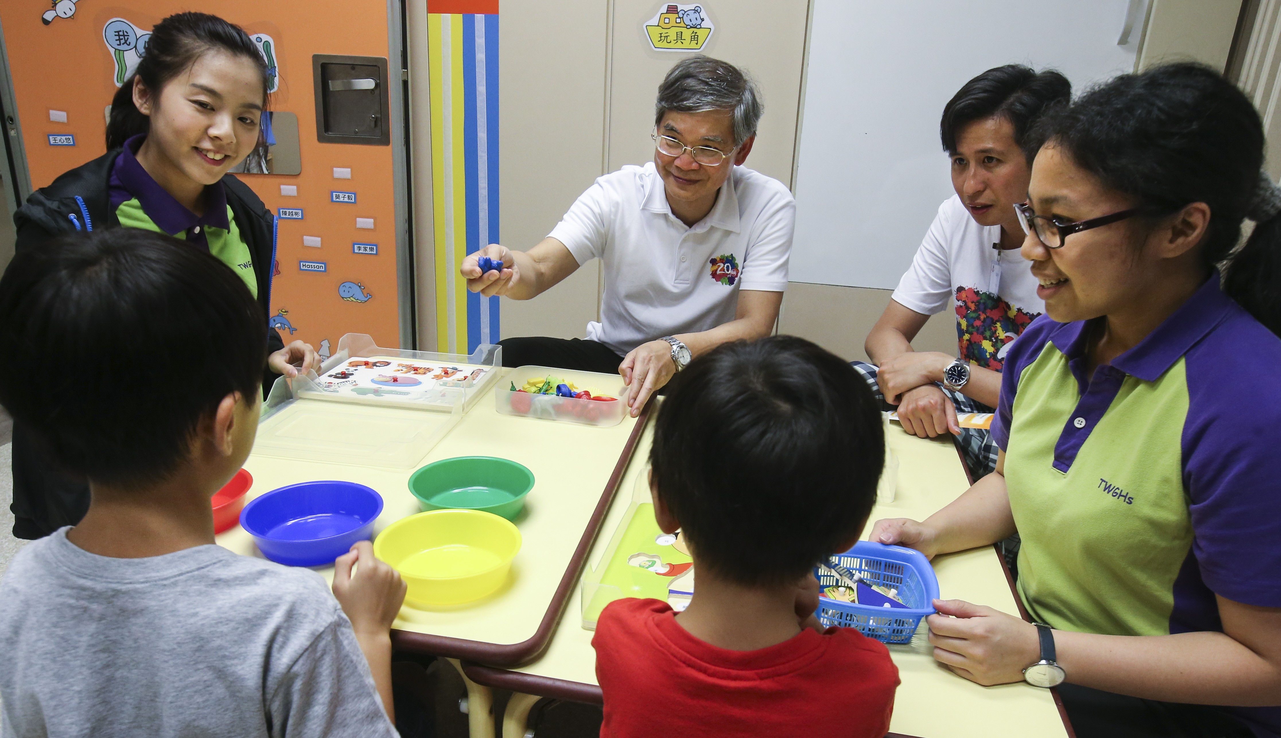 Law Chi-kwong, Hong Kong’s Labour and Welfare secretary,﻿ visits a childcare centre in Tin Shui Wai in July 2017. Photo: David Wong 