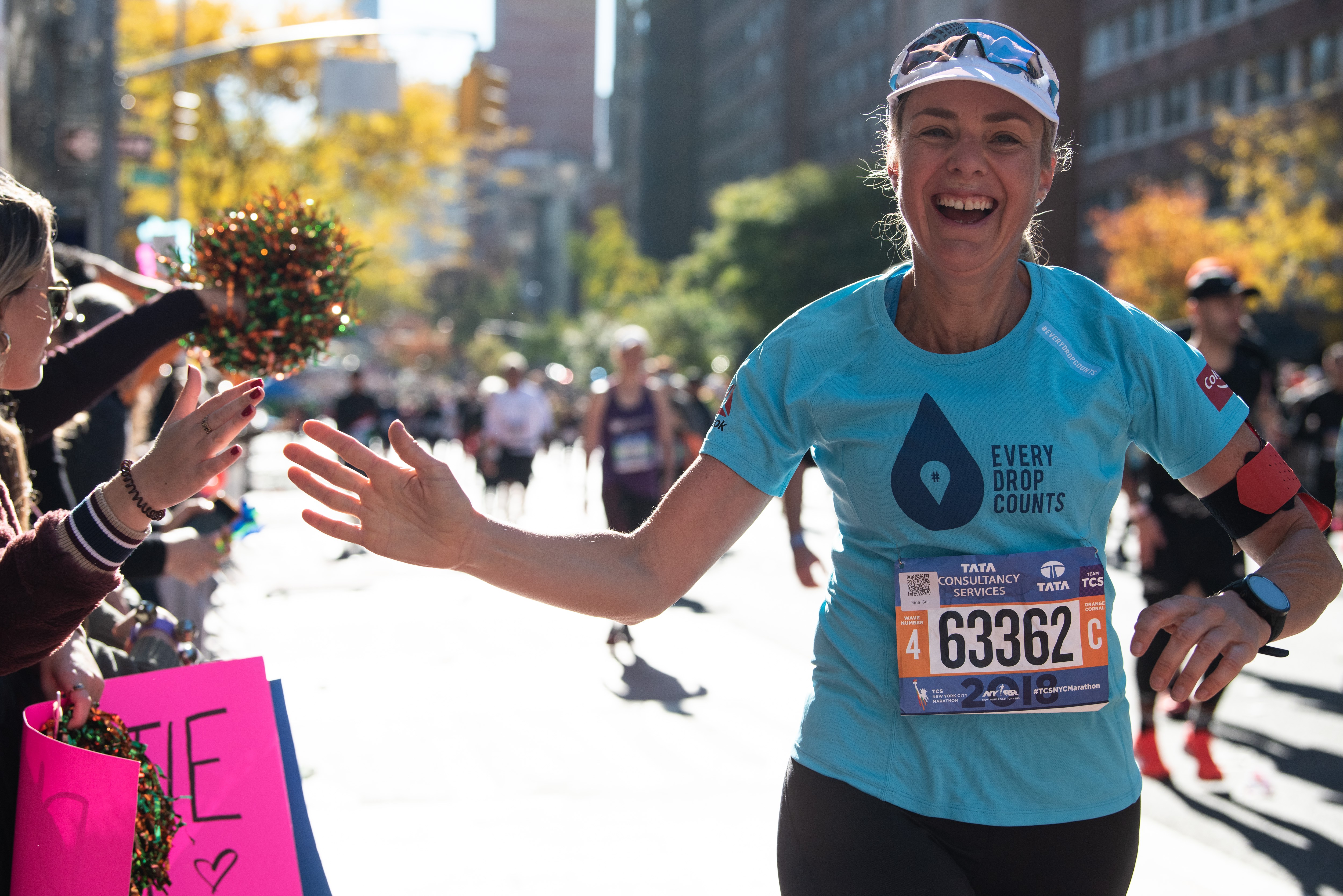 Mina Guli running the New York Marathon, her first of 100 consecutive marathons. Photos: Thirst