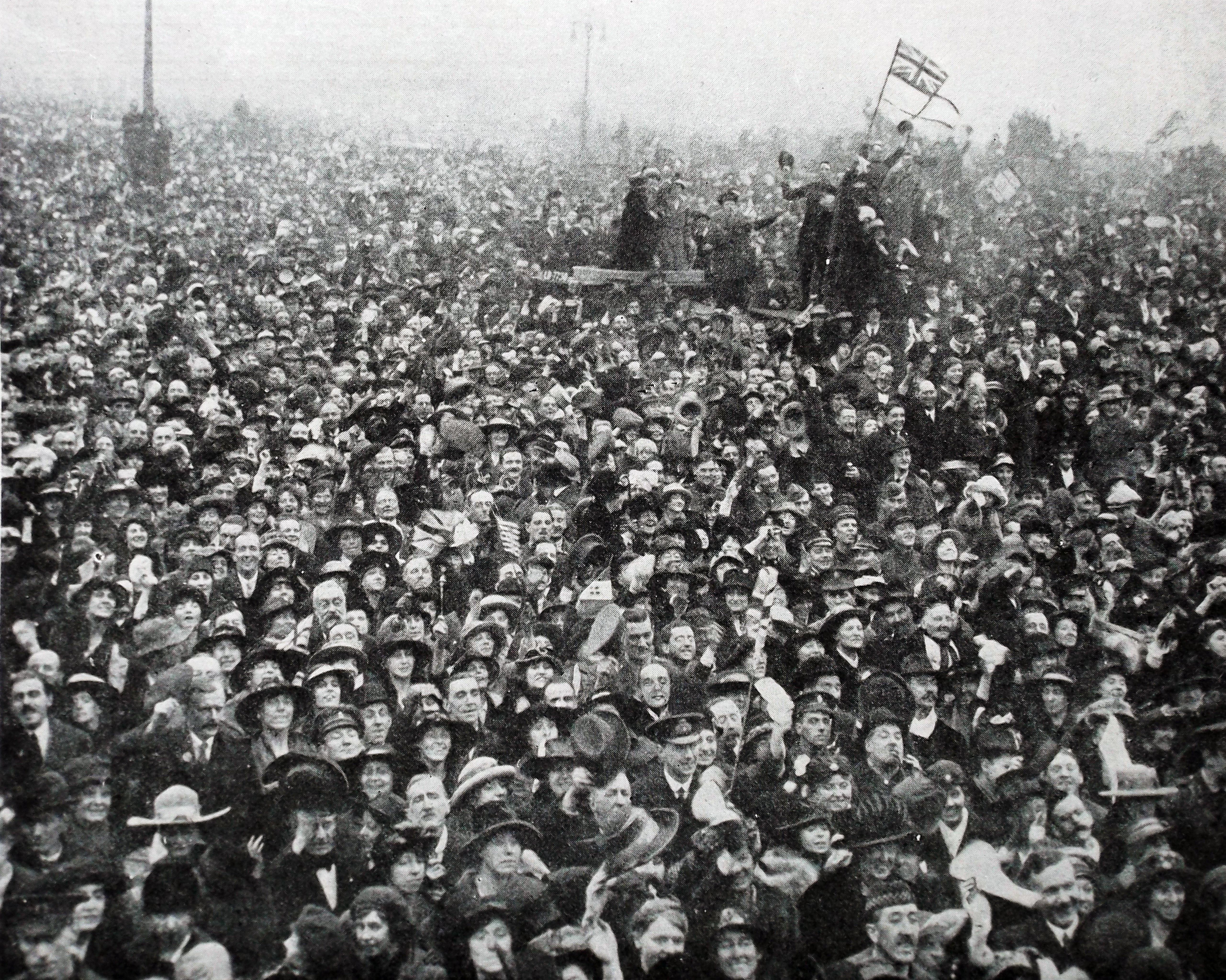 A crowd gathers outside Buckingham Palace to celebrate the end of the war, on November 11, 1918. Picture: Alamy