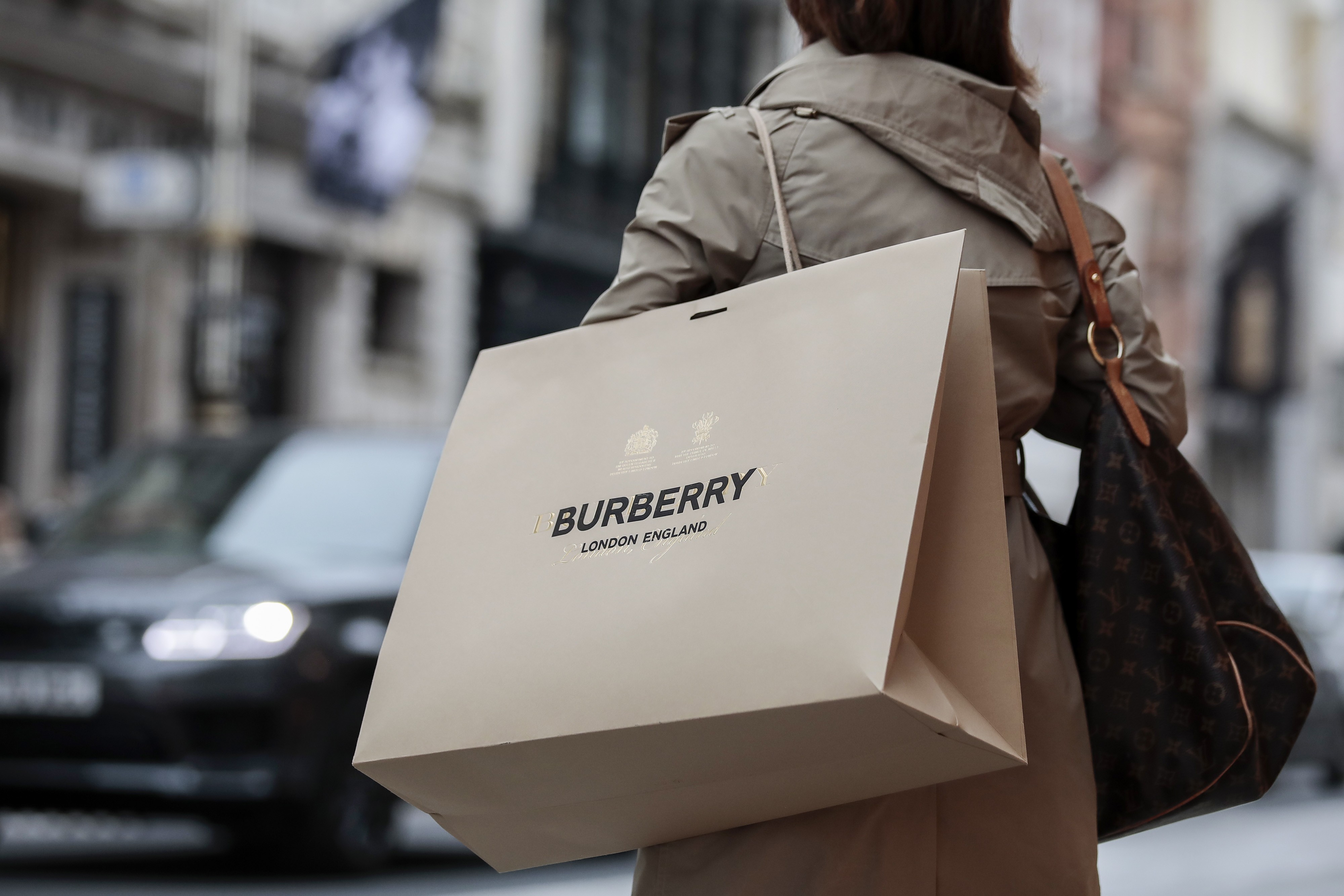 London, UK. 17th May, 2021. Shopper seen carry Burberry merchandiser bag.  The Prime Minister announced that England can proceed to Stage Three on May  17, 2021. Most shops can reopen including indoor.
