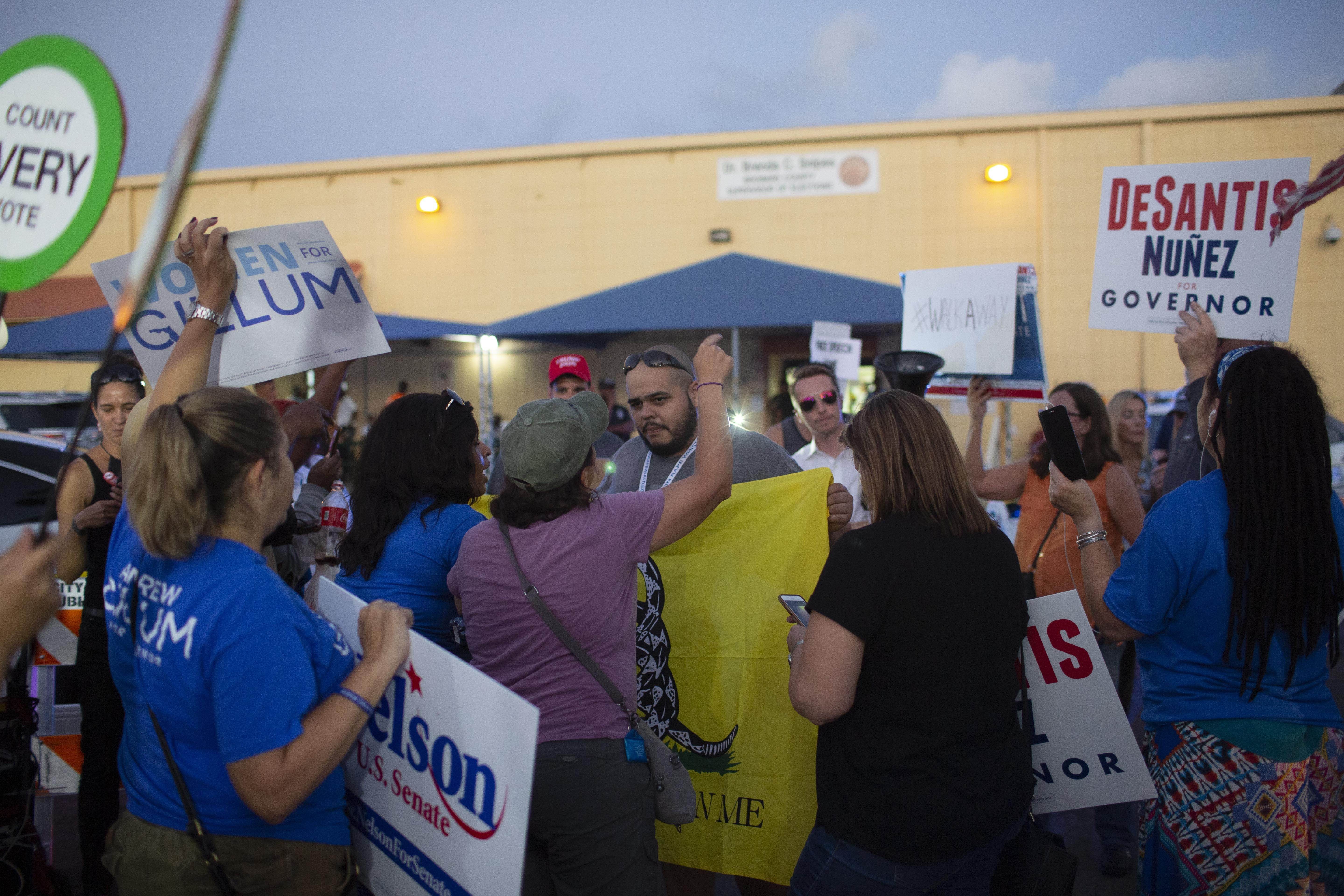 Protesters confront each other outside the Broward County Supervisor of Elections office on November 9, 2018 in Lauderhill, Florida. Photo: AFP