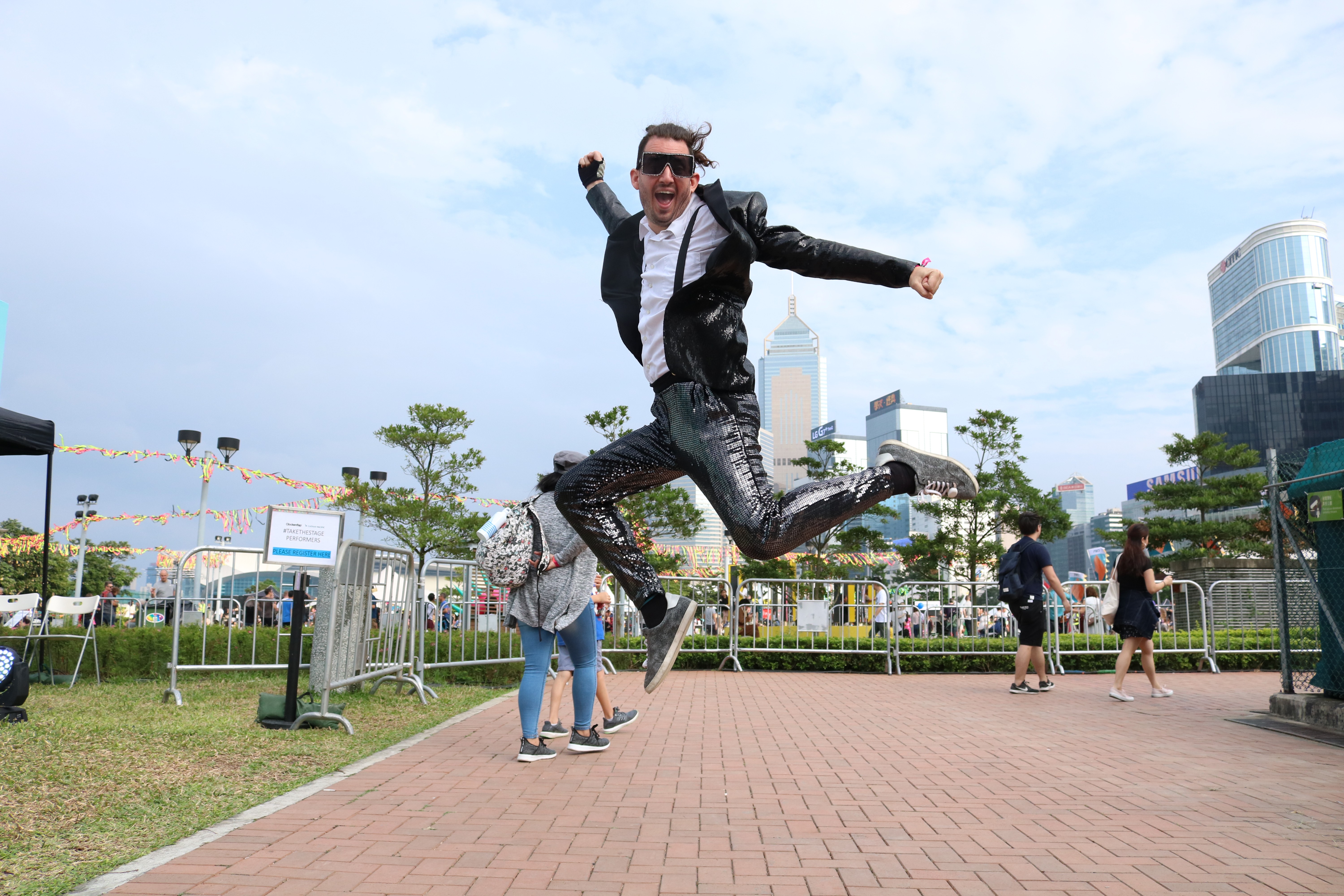You want me to show you my threads? A music fan in sequinned suit jumps to it at the Clockenflap festival on Hong Kong’s Central Harbourfront. Photo: Chris Gillett
