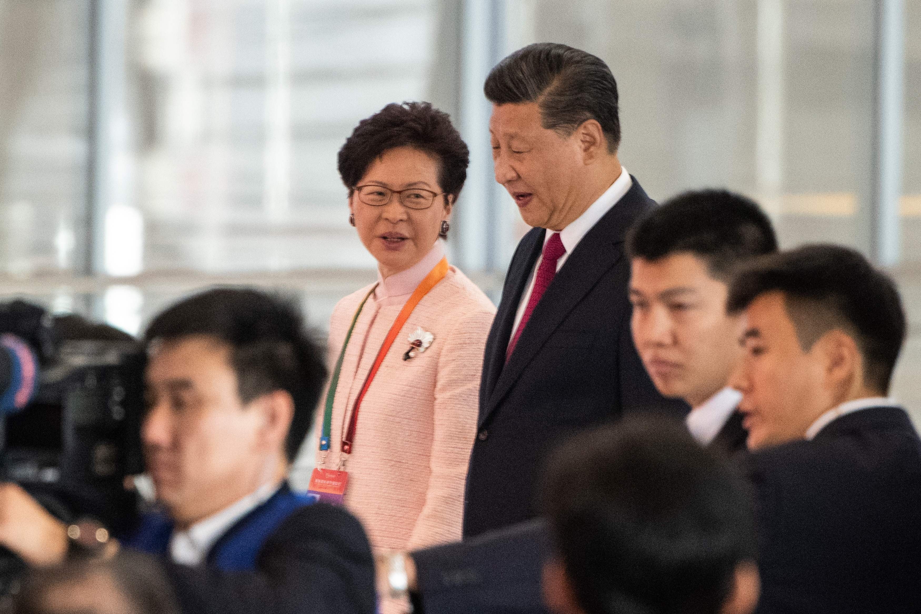 Hong Kong's Chief Executive Carrie Lam and China's President Xi Jinping arrive at the opening ceremony of the Hong Kong-Zhuhai-Macau Bridge at Zhuhai port on October 23. Photo: AFP