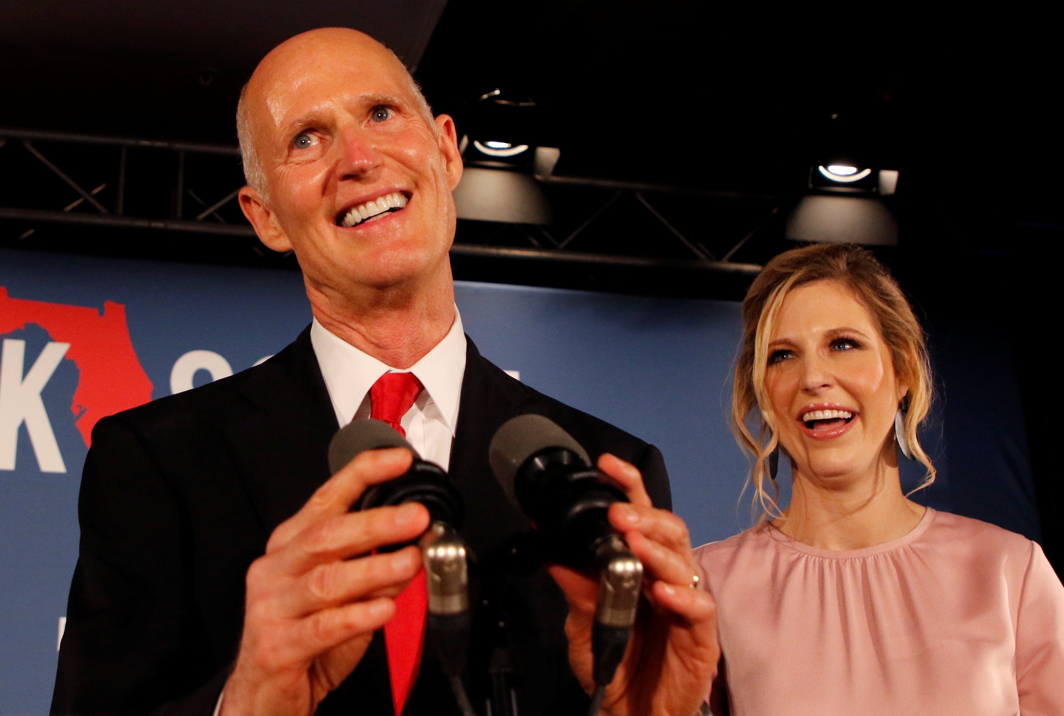 Rick Scott accompanied by his daughter Allison Guimard as he addresses supporters at his midterm election night party in Naples, Florida. Photo: Reuters